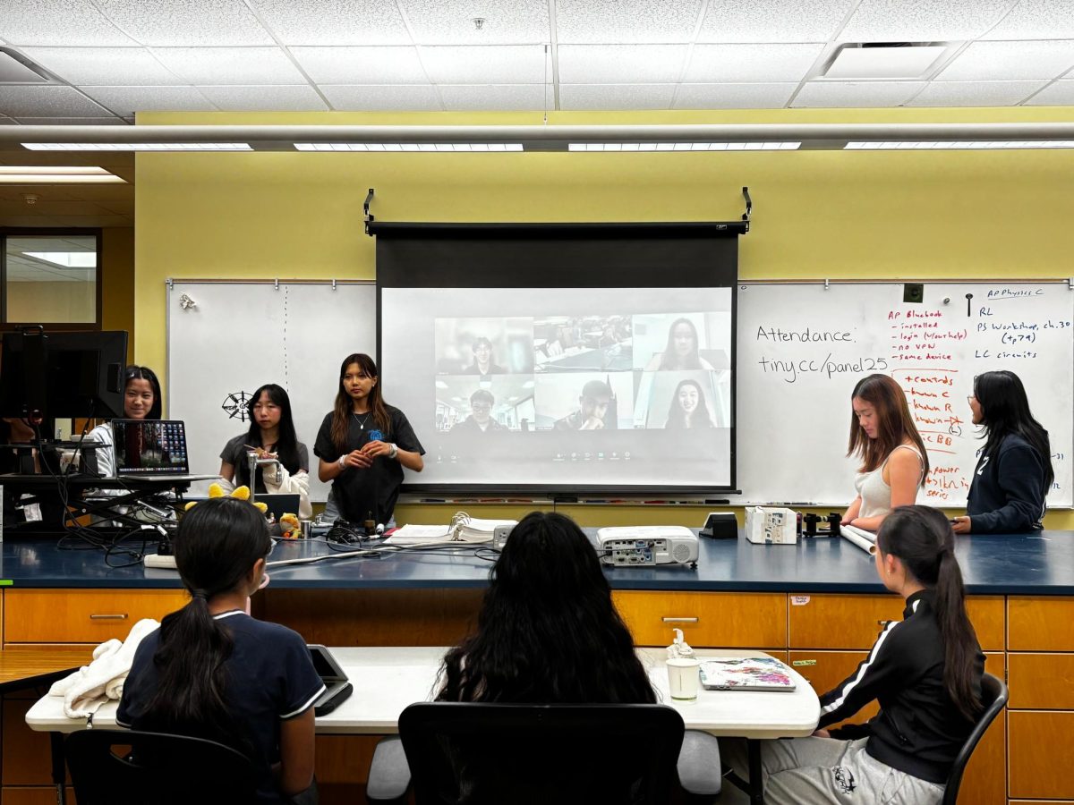 Attendees listen as Research Club officers ask the alumni panel about their research experiences in high school and college. For high school students interested in advanced research, the panelists recommended cold emailing professors and networking with teachers and older students in college,
