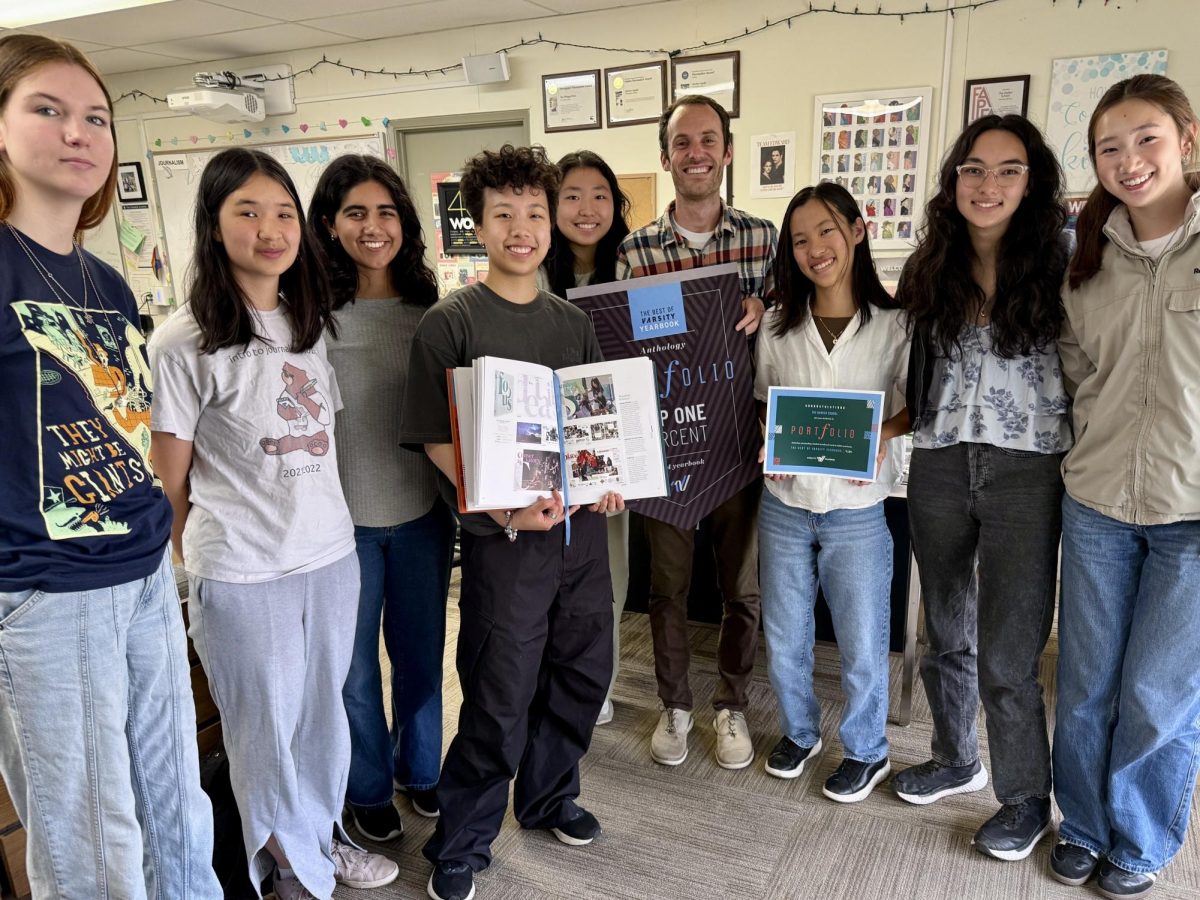 Yearbook adviser Kevin Oliver joins TALON editors to show off their Best of Varsity Yearbook prize, celebrating the staff’s national recognition. Oliver led the yearbook staff to win a Pacemaker Award from the National Scholastic Press Association this April.