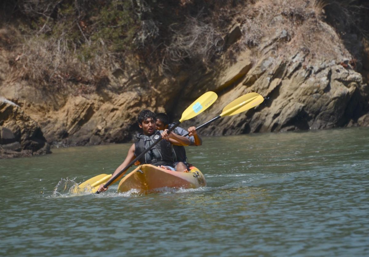 Chanting to coordinate their paddling, juniors Arav Vuppala and Neel Kumar accelerate on the kayak. Students also swam, played sports, and enjoyed the beach at Ayala Cove.