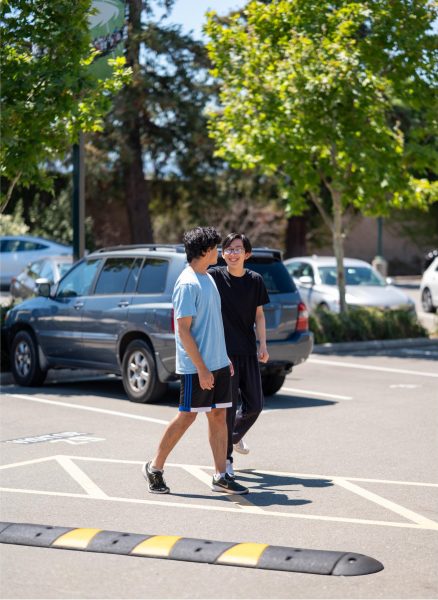 New speed bumps and crosswalks  mark the loading zones. They were installed in response to safety concerns around speeding in the parking lots.