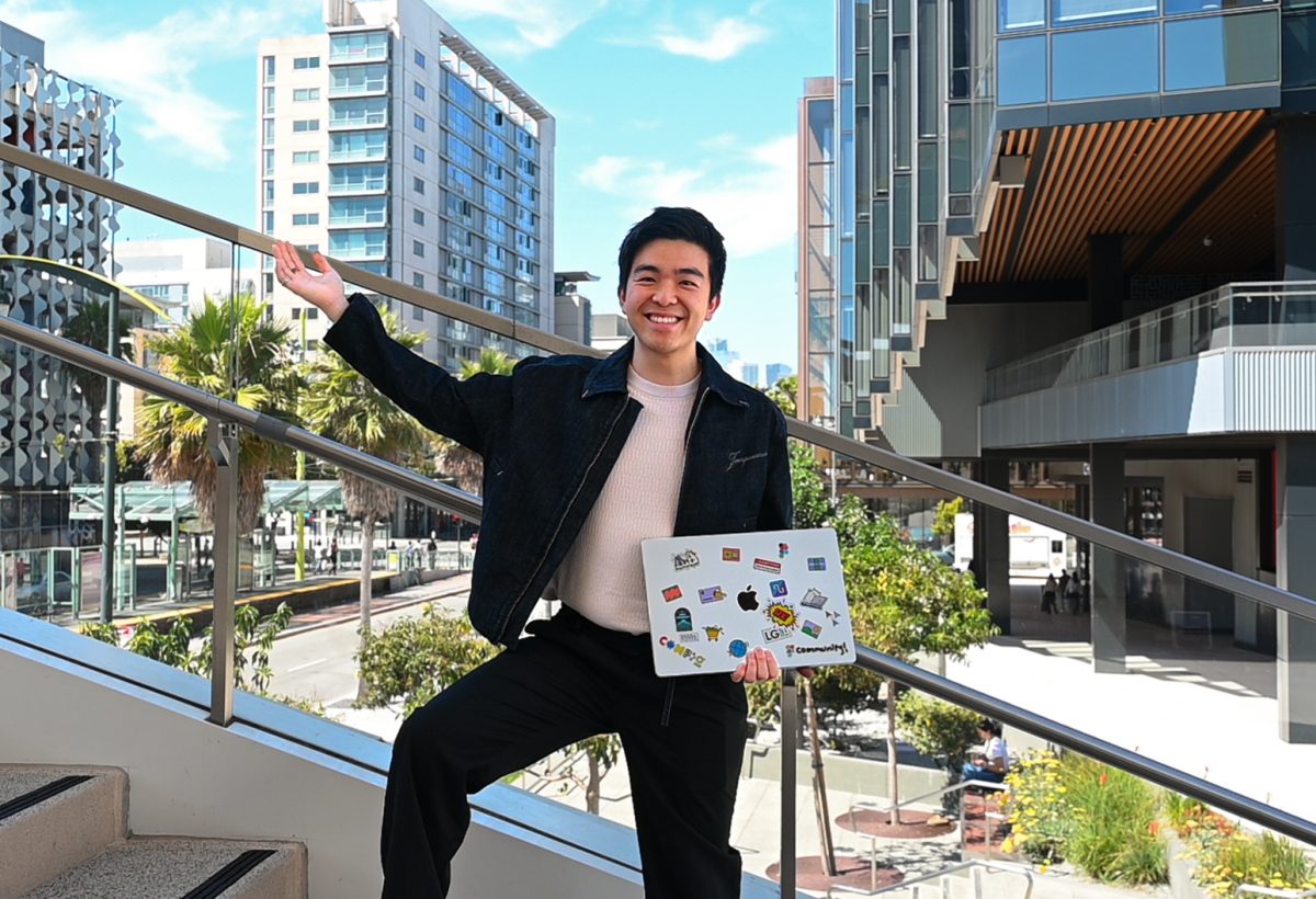 Figma technical lead Matthew Huang (’15) smiles on the steps of San Francisco’s Alamo Square near Figma’s headquarters. He embraces the team-focused, dedicated nature of his work.