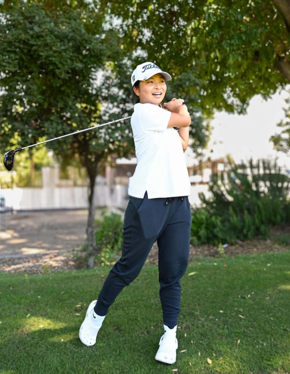Sai Kaneshiro (10) warms up her swinging technique during a practice. “I try to not think about [the pressure] too much and just take it one day at a time, one tournament at a time,” Sai said.
