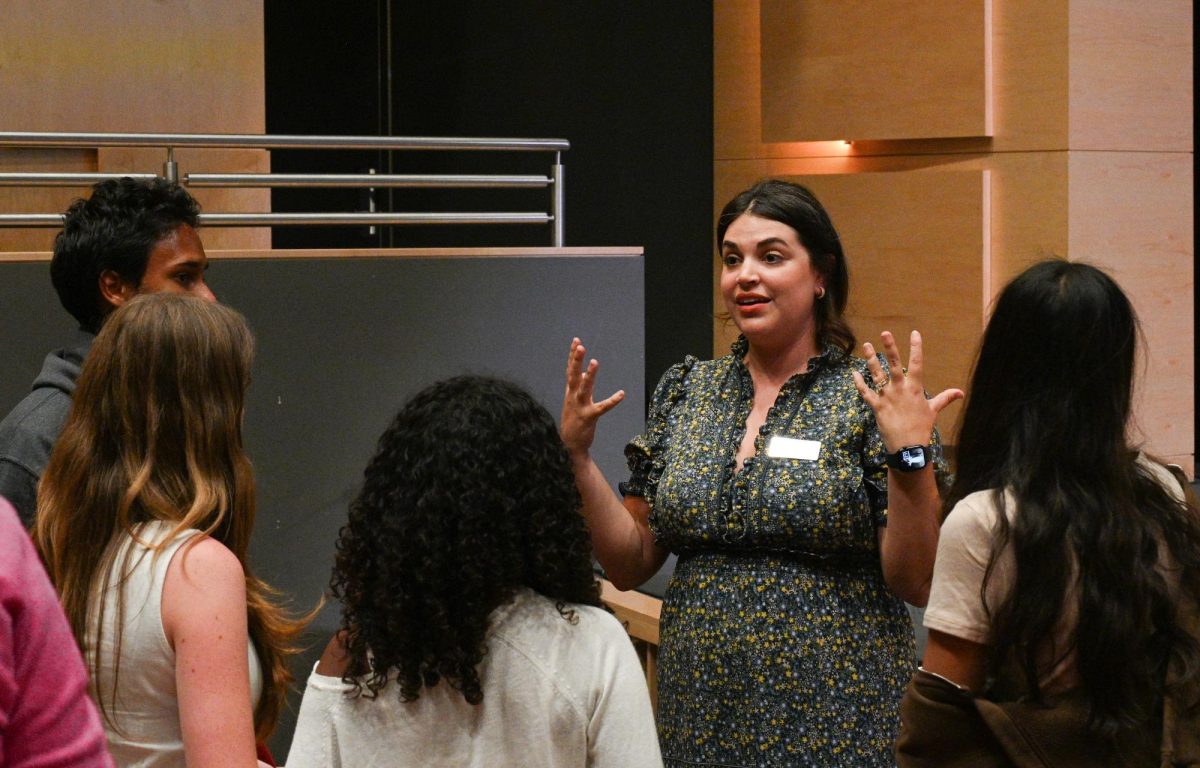Theater teacher Brandi Griffith explains details of the Certificate program to a group of frosh. The Certificate program allows students to focus on one performing arts discipline throughout high school.