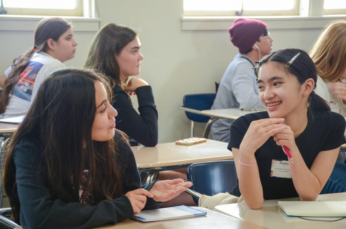 Reporter Addison Nguyen (9) at the “ChaRIZZmatic Communications” session discusses ways to implement team bonding activities at her own high school, University Preparatory Academy. The session offered many opportunities for students to interact with journalists with other schools and form new friendships.