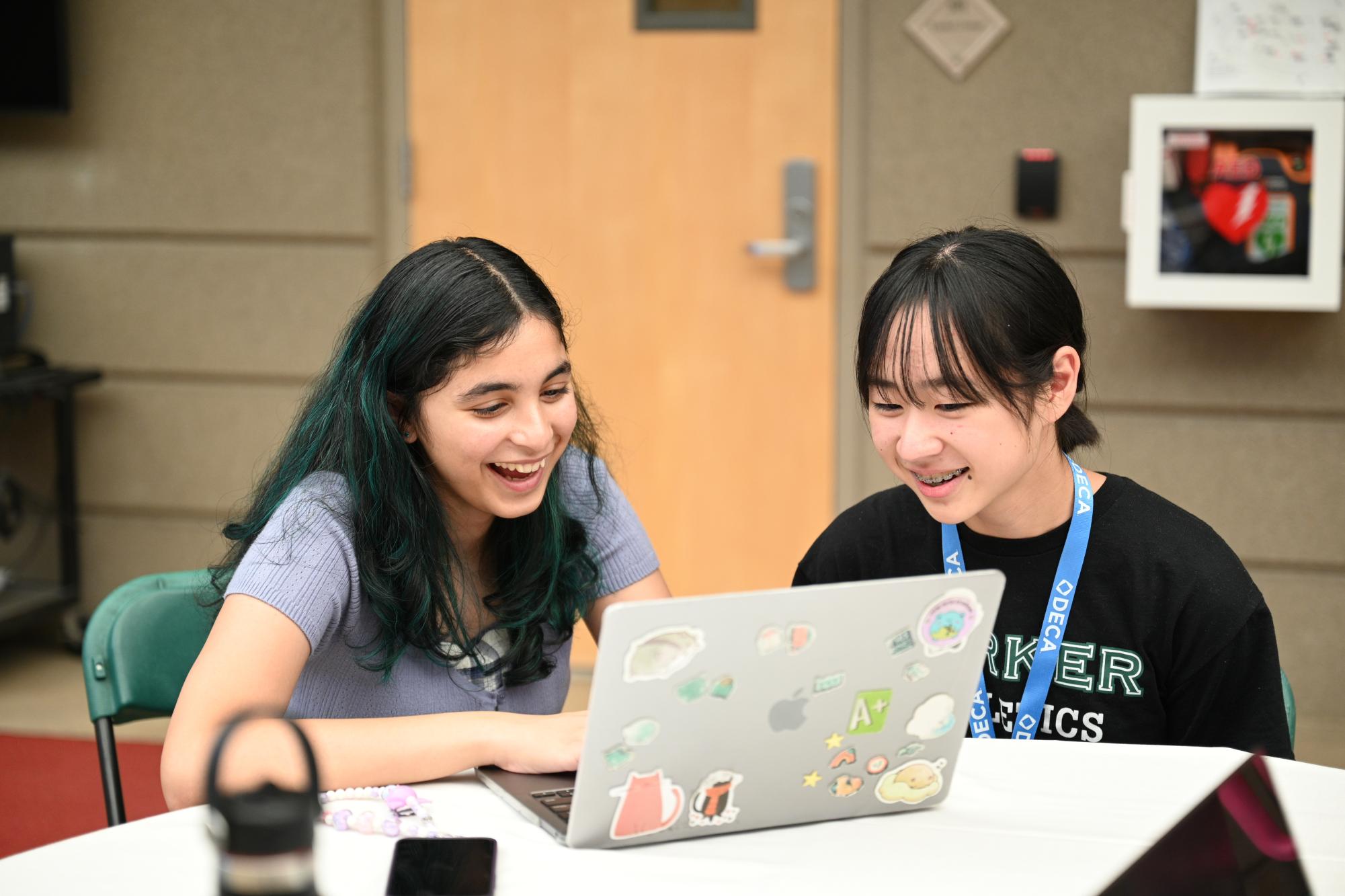 Frosh Annika Pendse and Ziyang Wang work on their Innovation Challenge project. The event gave students opportunities to collaborate with peers and learn more about DECA.