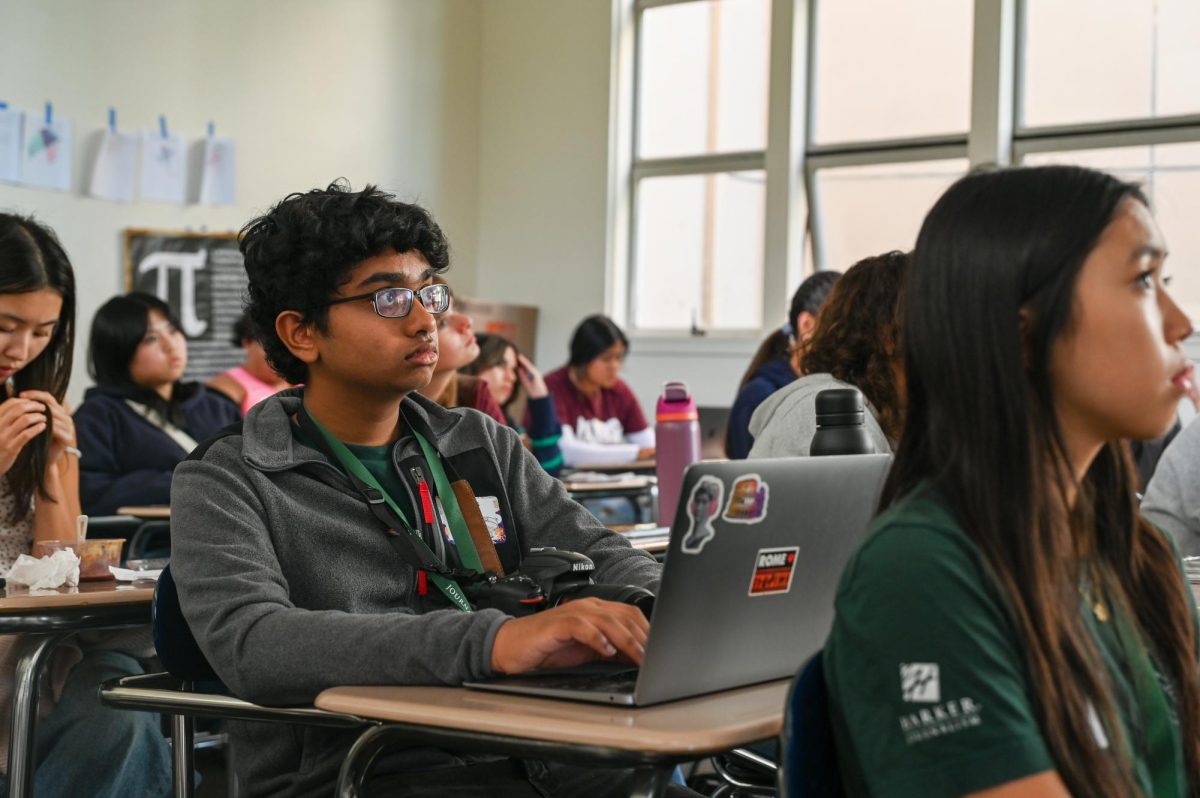 Frosh Shreyas Karnam takes notes during the "Design Like a Pro" presentation at JEA NorCal Media Day. The session focused on four elements of strong design: contrast, repetition, alignment and proximity.