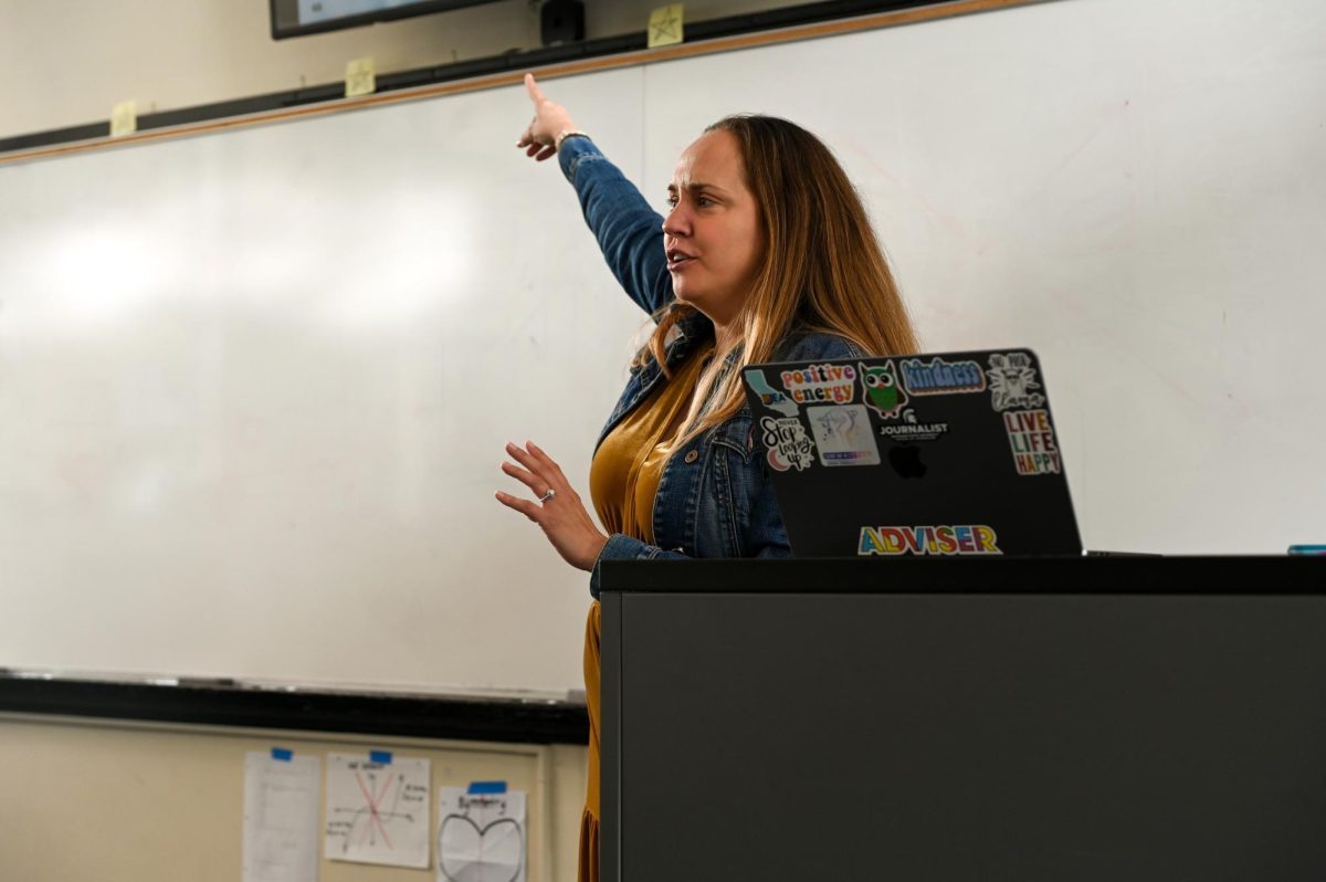 JEA President Julia Satterthwaite showcases various designs from different publications to inspire attendeels to create stronger spreads. At the end of the session, students designed example spreads using what they learned.