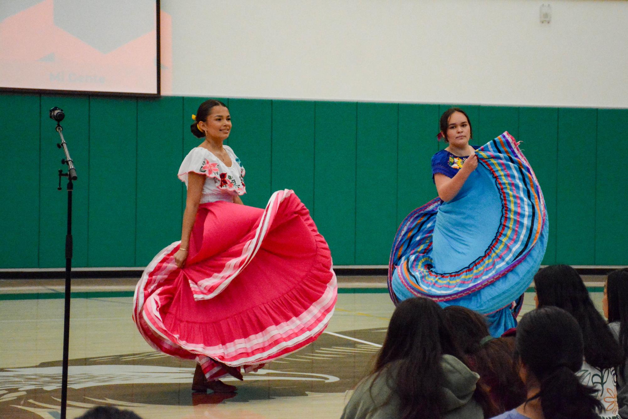 Sofia Vasquez-Perez (12) and Natalie Warmdahl (11), officers of the LatinX Affinity group, perform a traditional folklórico dance. Their performance honors Hispanic Heritage Month, celebrated annually from September 15 to October 15.