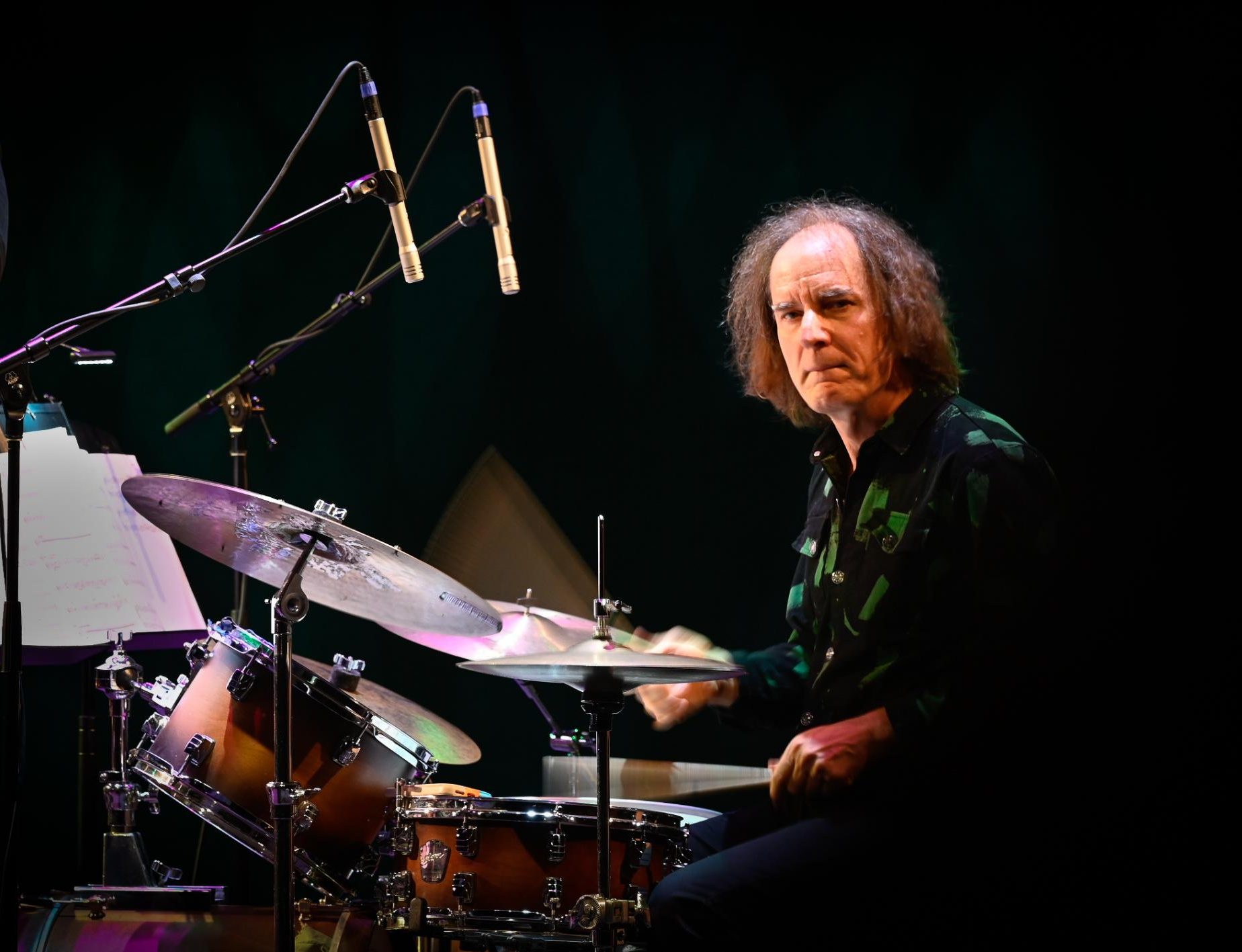 Drummer Chris Wabich powers through a drum set, his sticks blurring in motion. Even during other members' improvized moments, Wabich supported them with a consistent rhythm.