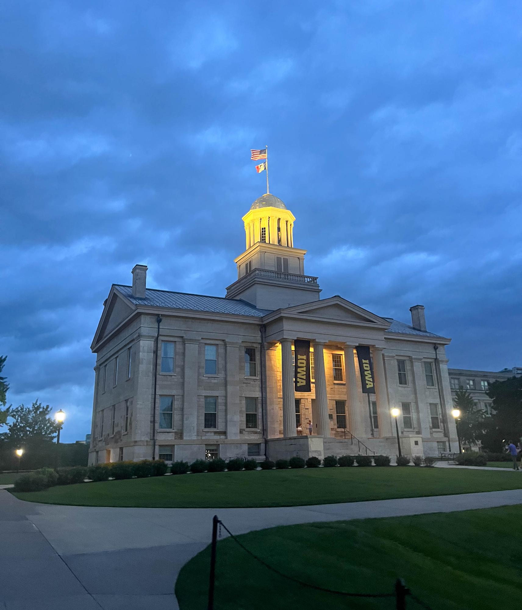 Old Capitol, University of Iowa's main building, sits in the middle of a park and lights up at night.