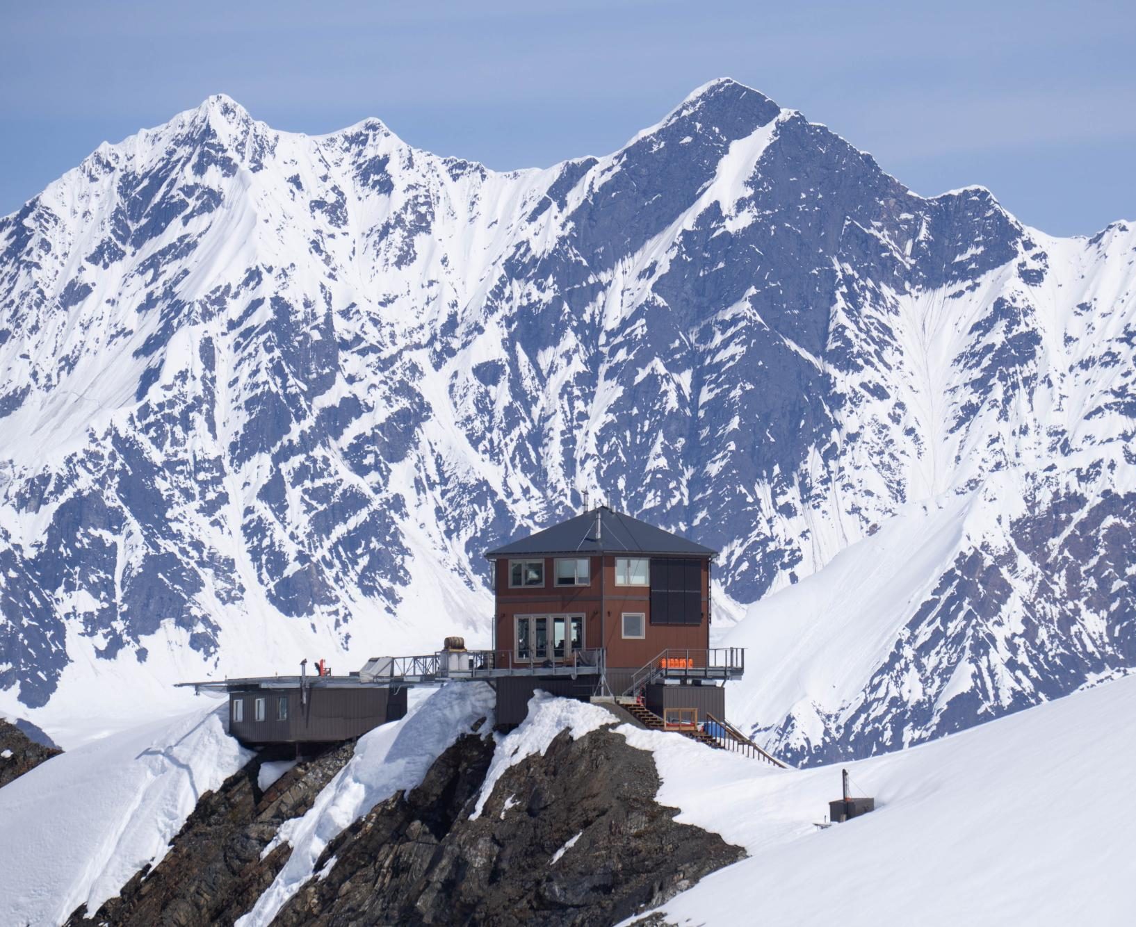 A small ski chalet sits atop a a ridge on Mount Denali.