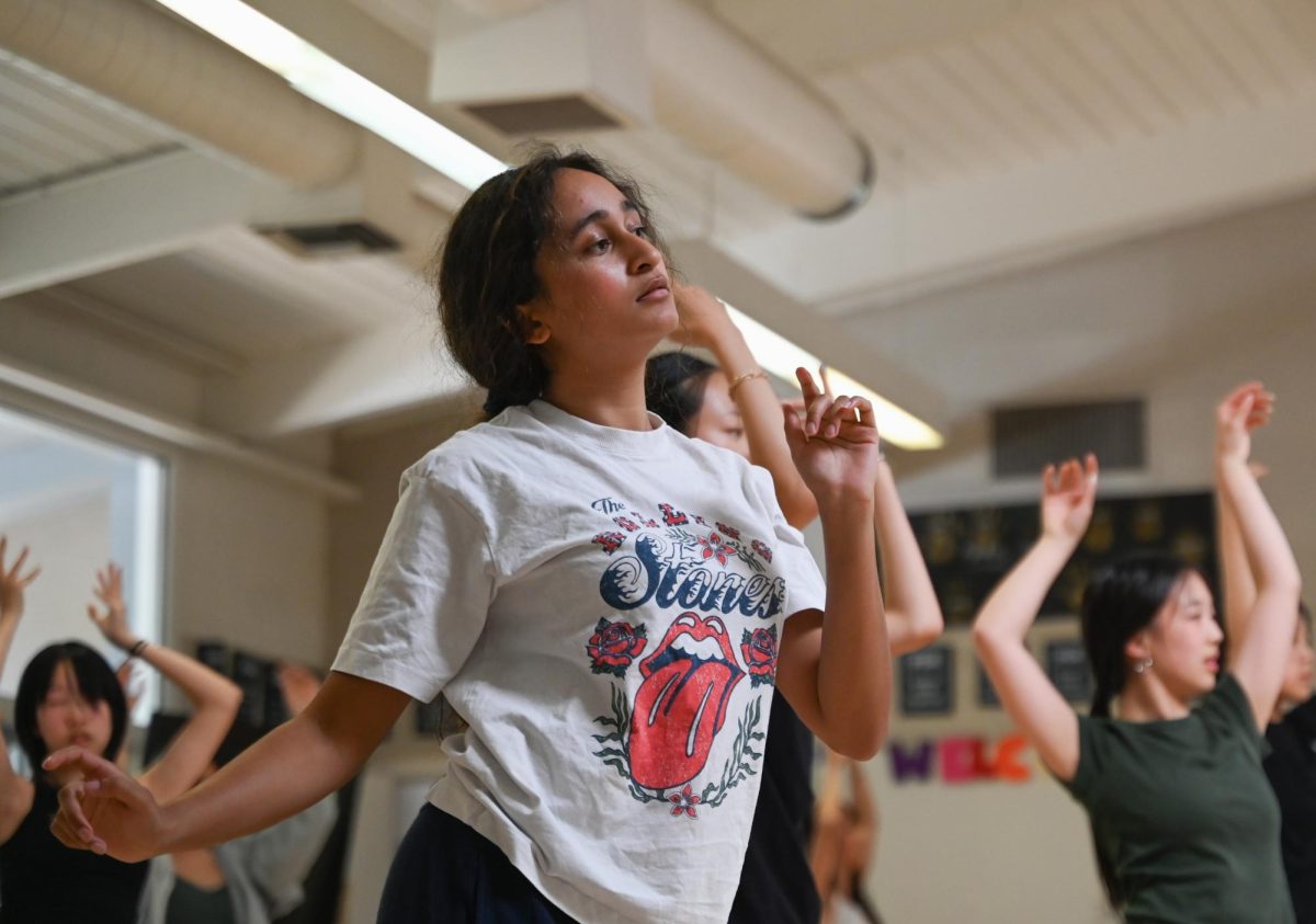 Sophomore Tanvi Dhoot slowly melts through a move with her own personalized flair. “He gives us a lot of freedom to choose what we do with the moves,” attendee Jennifer Liu (11) said. “He told us to ‘melt’ between moves — you have a lot of control and a lot of time to find your feeling in the moves.”
