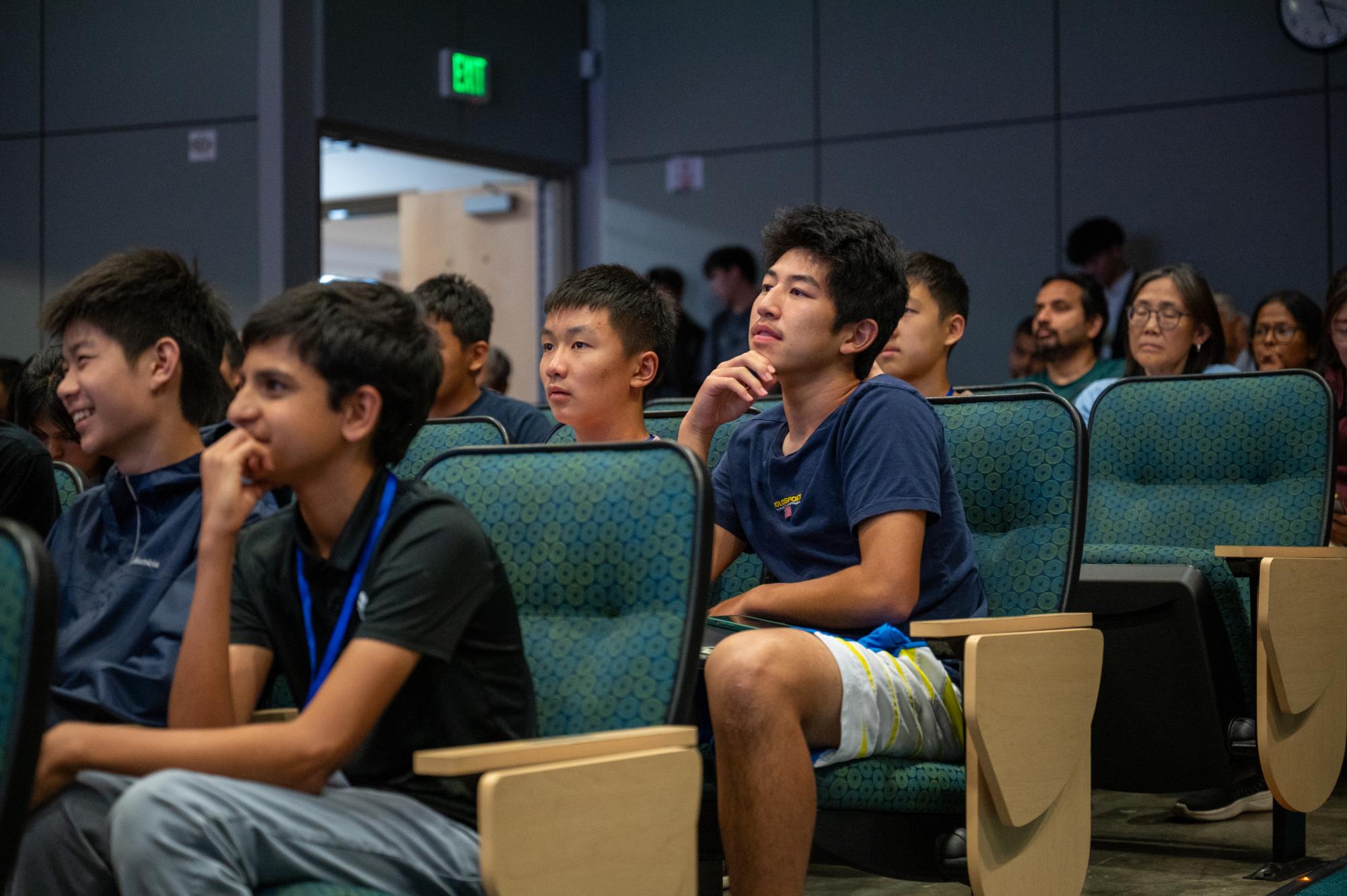 Frosh Ethan Yu and Ethan Xu listen to the alumni panel in Nichols Auditorium. Panelists discussed their experiences competing in DECA. 