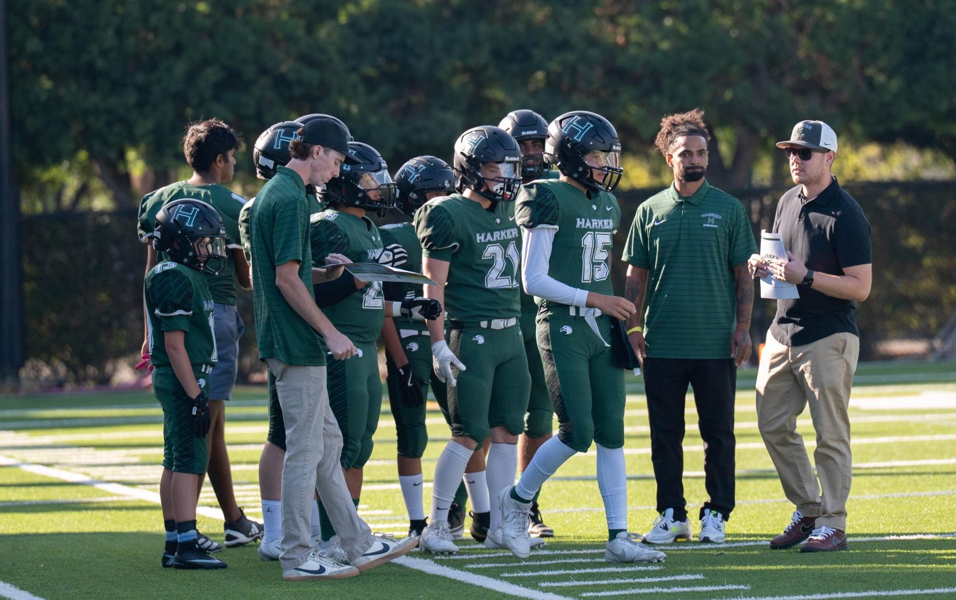 The varsity football team takes the field before their home season opener against BASIS on Sept. 11. Injury concerns due to small roster size pushed Harker to cancel the traditional homecoming football game.