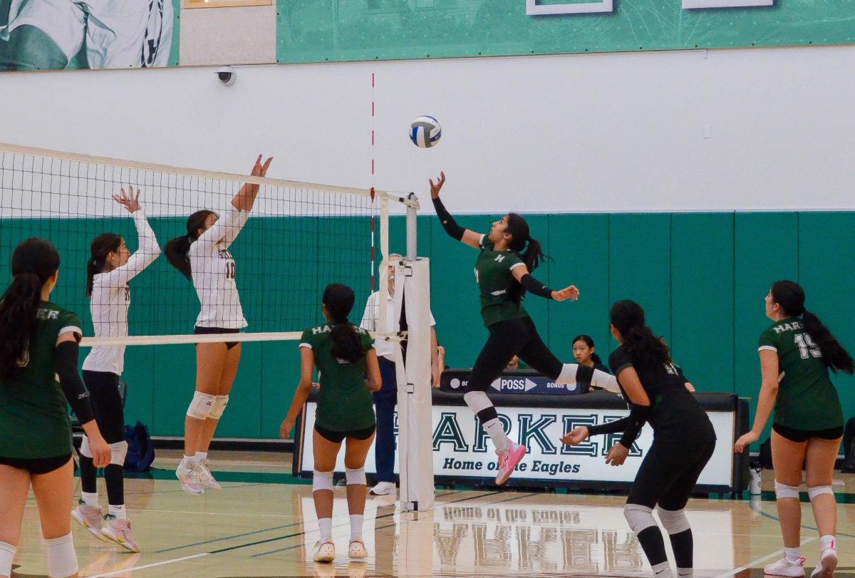 Opposite hitter Aarya Vaidya (10) jumps to tip the ball over the net. Although she scored multiple points with her tips and hits, the team lost to Sacred Heart 1-2.