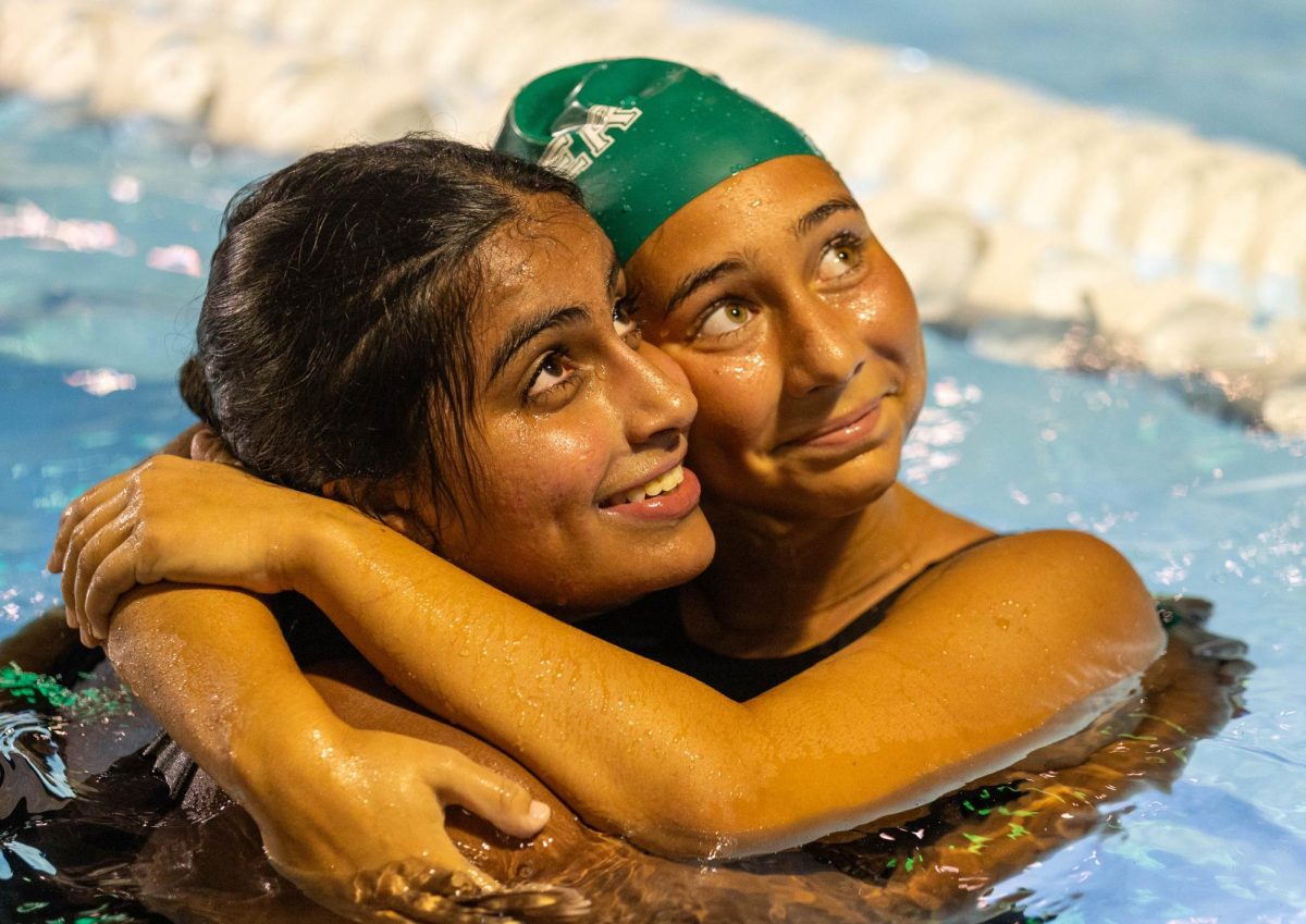 Junior Tvisha Ganesh and Senior Alana Brill embrace after the senior night game, celebrating the bonds formed on and off the pool deck during the season. The moment marked a memorable end to the seniors' time on the team.