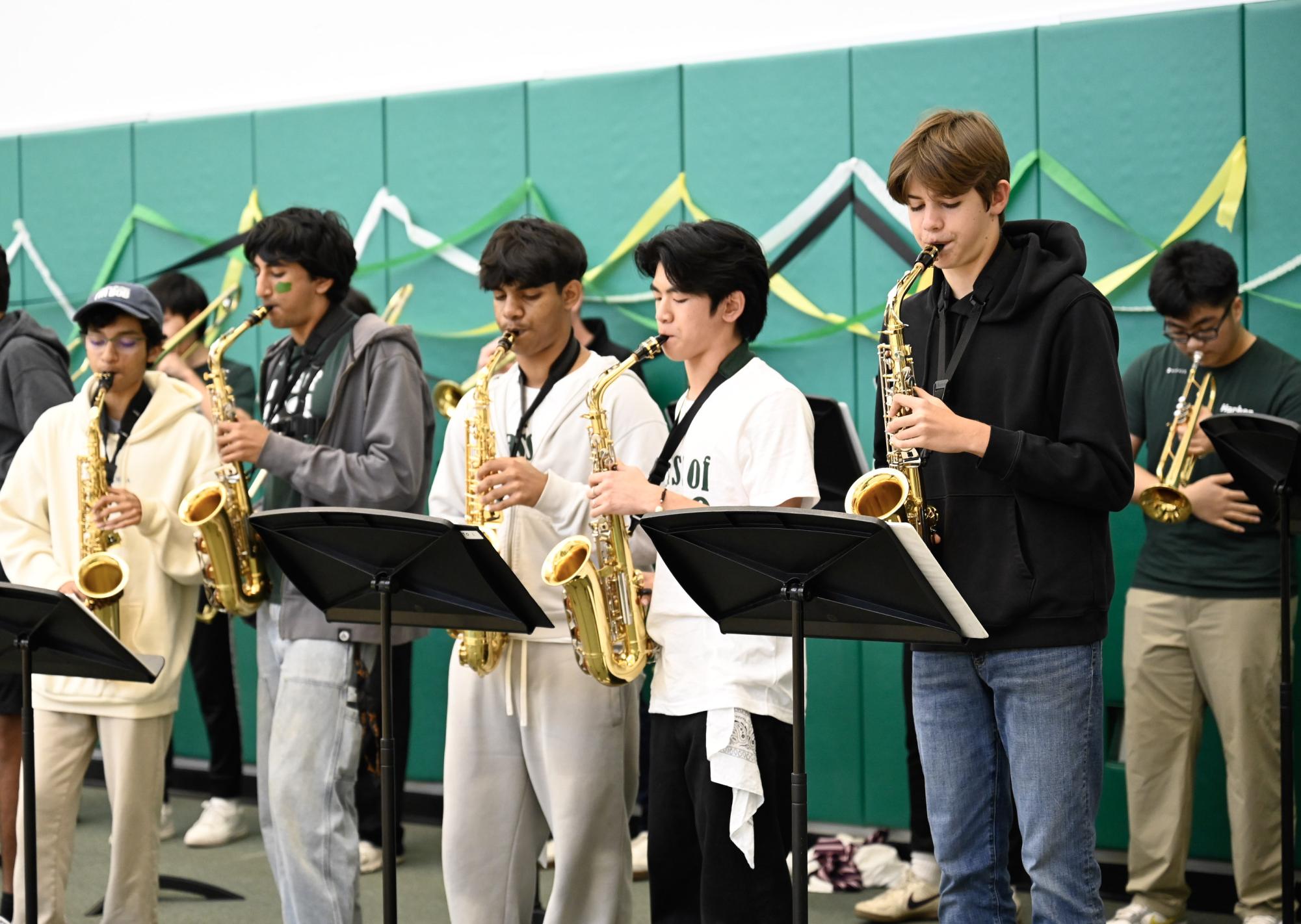 Jazz band members perform before the spirit rally begins. They led the parade from the Quad to the Athletic Center.