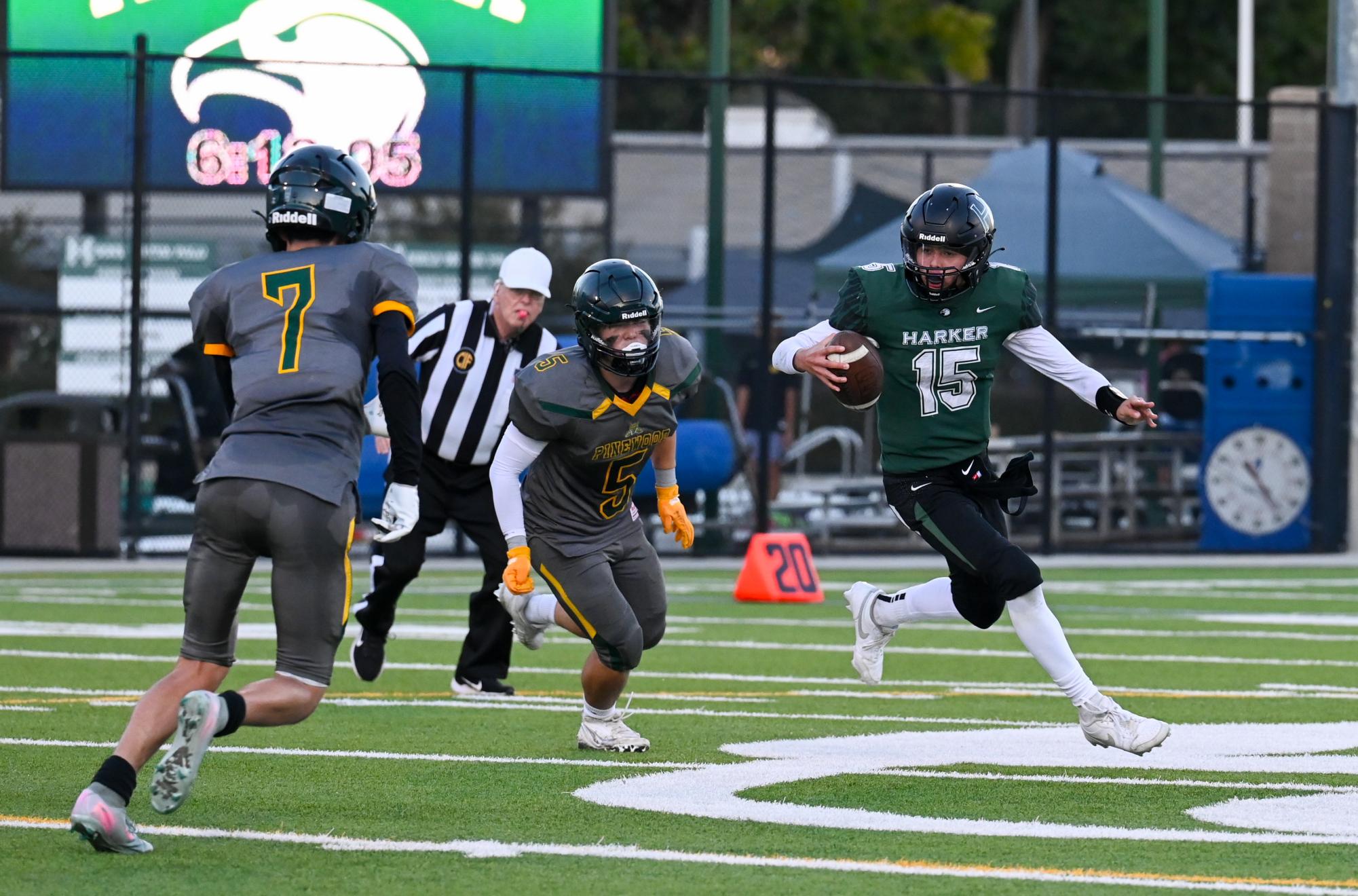 Quarterback Ricardo Sanchez (9) carries the ball as he searches for a pass. This game was also senior night for both football and cheerleading.