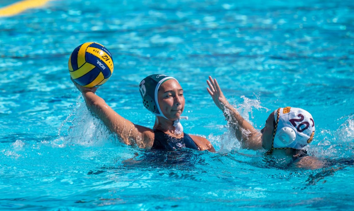 Alana Brill (12) looks for a pass. Alana contributed multiple goals and made several key passes during the game.