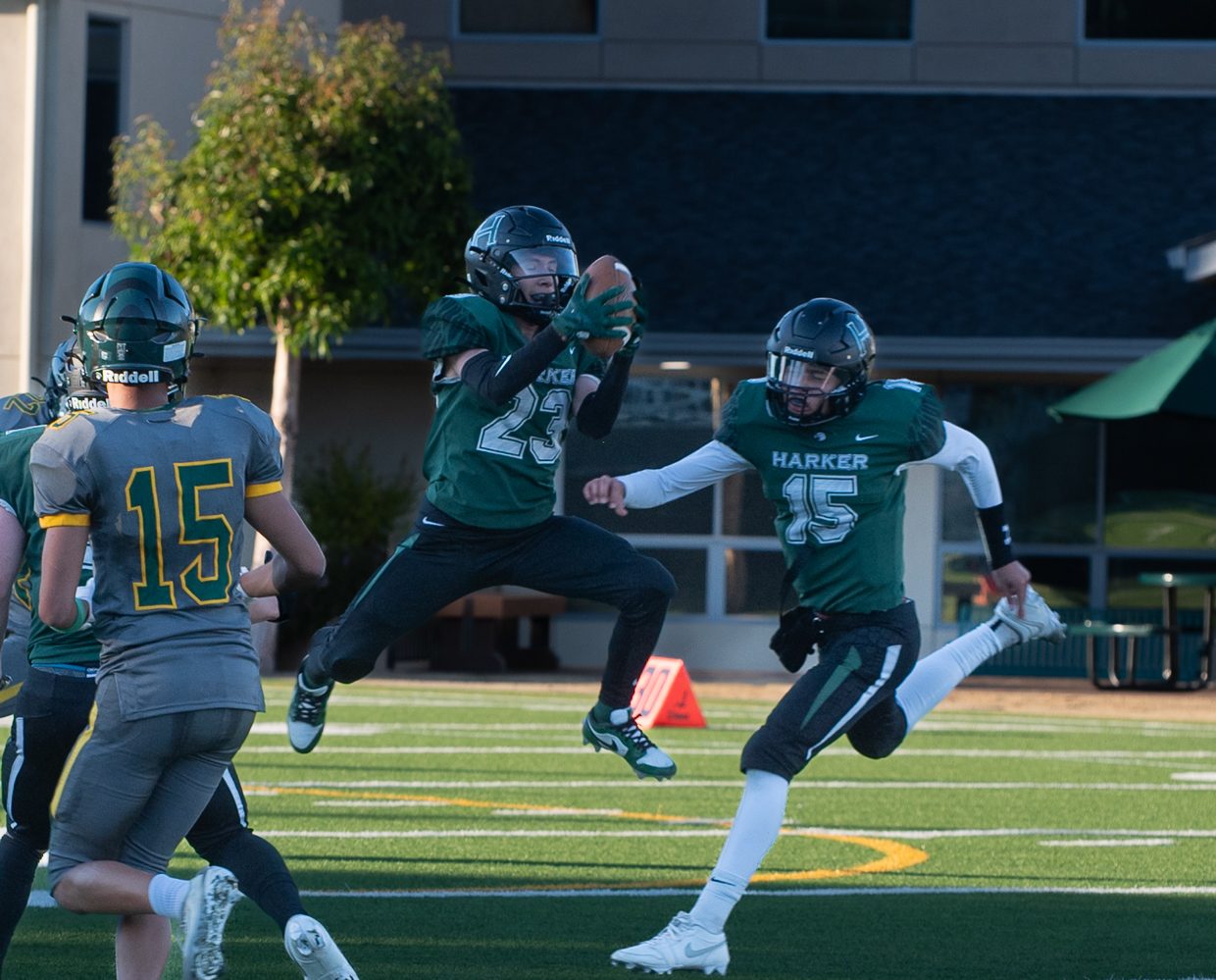 Running back Pedro Castro III jumps to grab the ball, giving Harker possession. Numerous interceptions by Pedro contributed to the Eagles' victory.