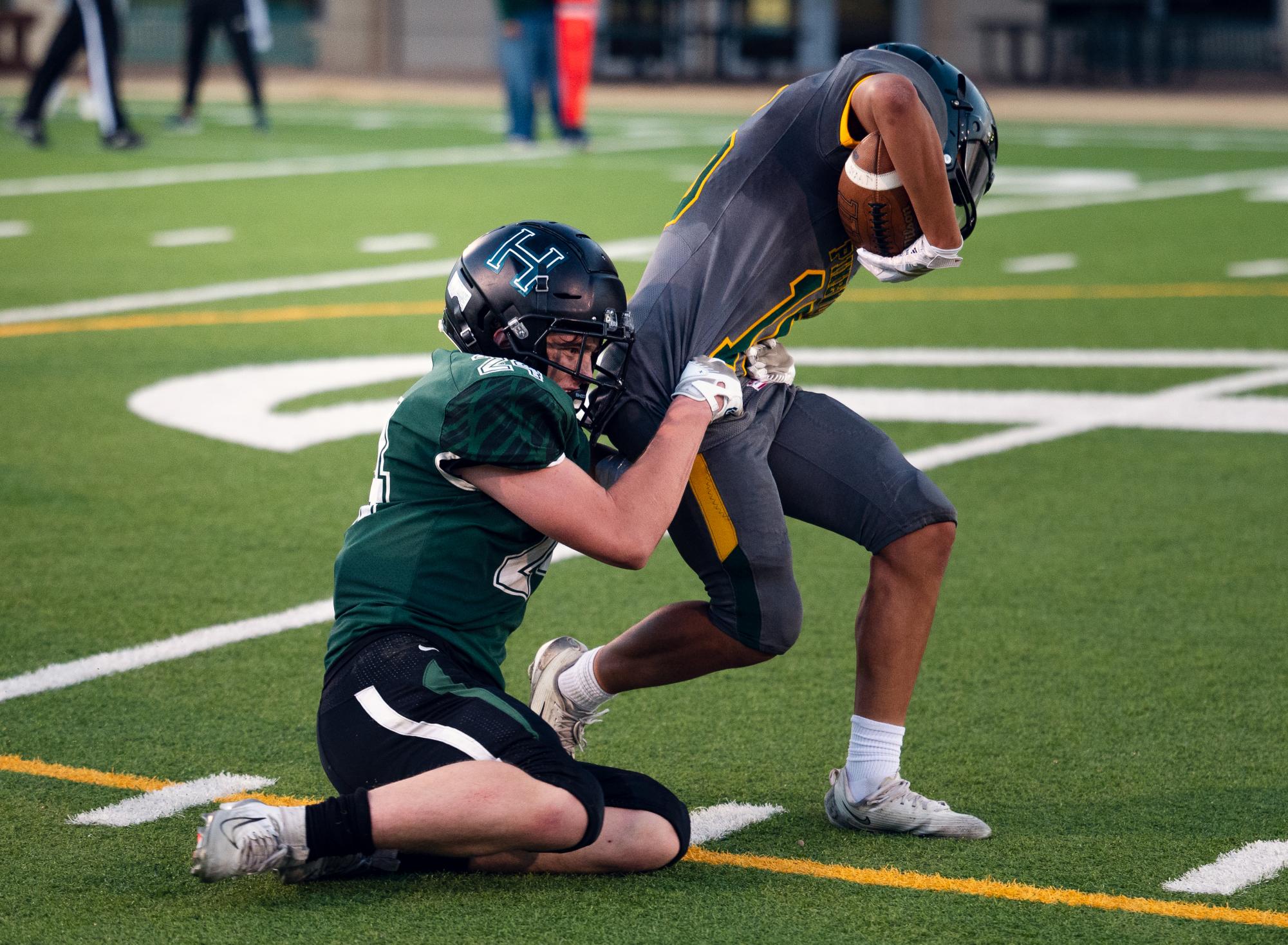 Mason Brooks (11) pulls down a Pinewood player. The Eagles' defense held firm against the Panthers, only conceding a single touchdown.