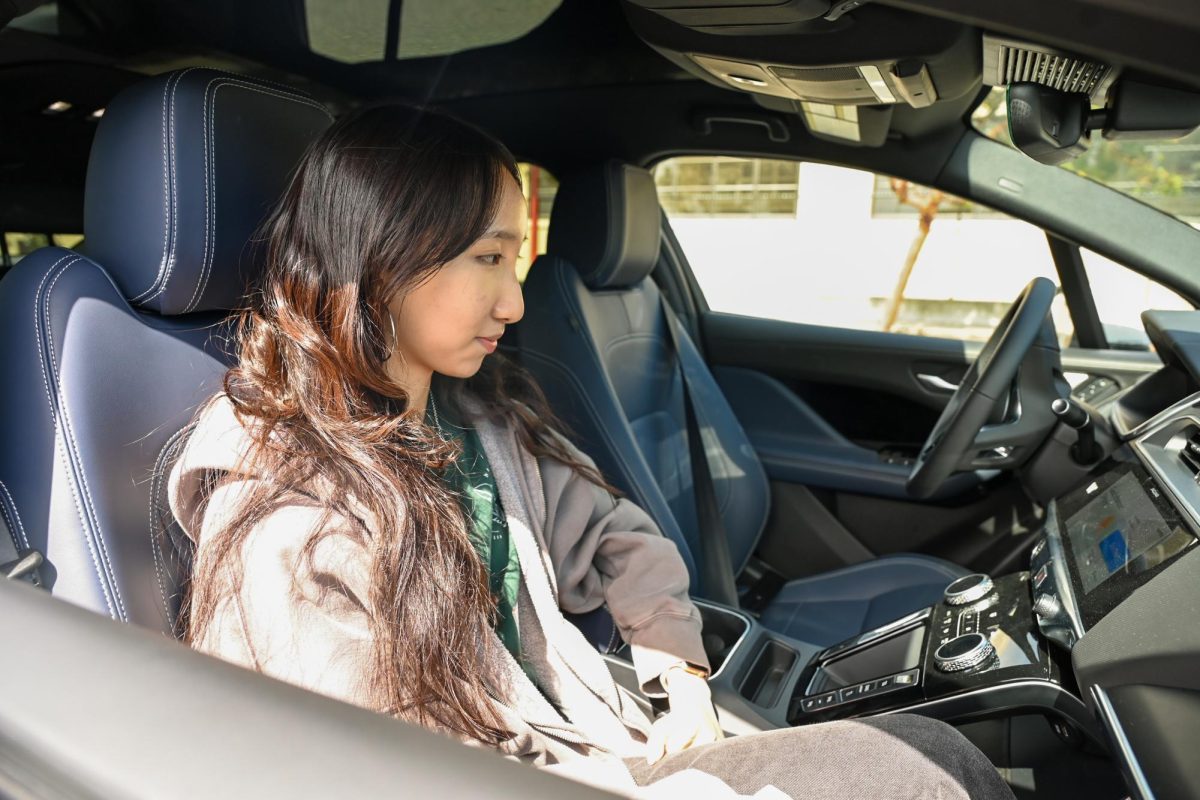 Senior Lily Shi sits inside a Waymo vehicle in San Francisco, which she called using the Waymo One
app. Waymo received permission from SJC to test and operate at the airport before large sporting events draw crowds in 2026.