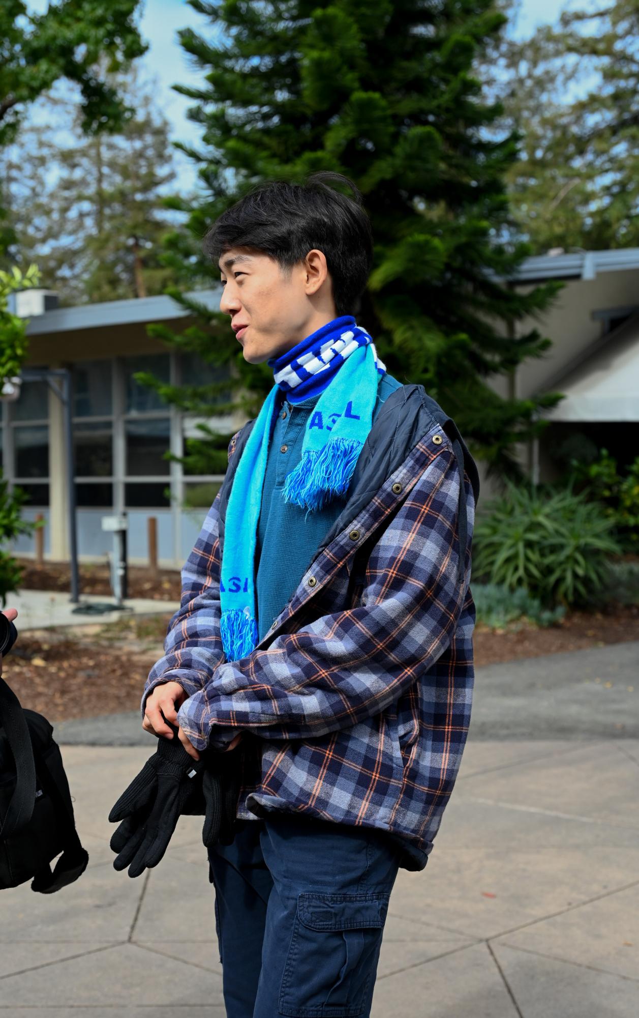 Junior David Tang waits in line to check in for spirit dress-up points. He chose to dress as an Arctic explorer, adding a creative spin to the theme of "Wilderness Wednesday."