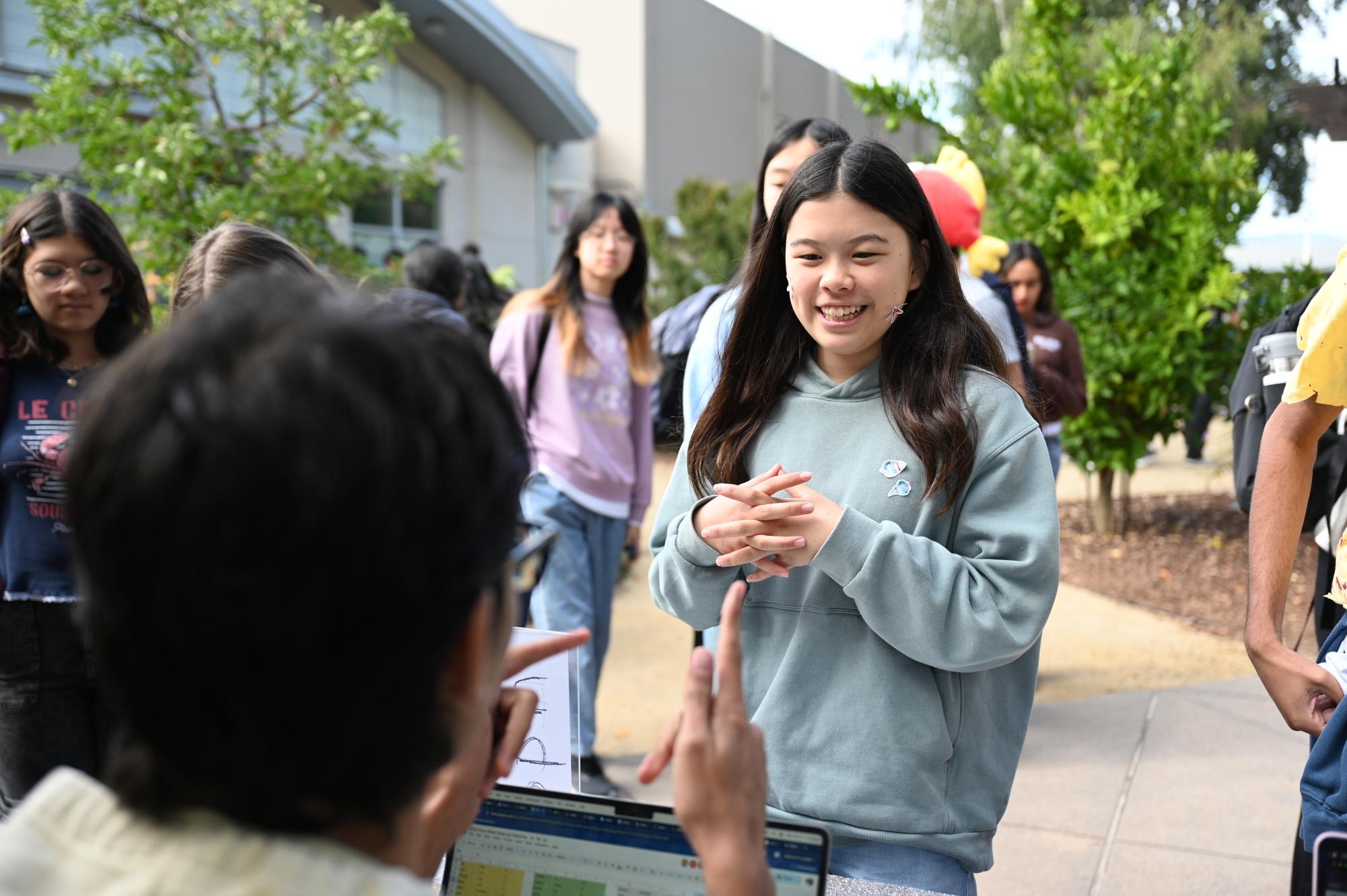 Frosh Iris Wang checks in for spirit dress-up points. The frosh theme was under the sea, so she wore blue and included stickers as an accessory.