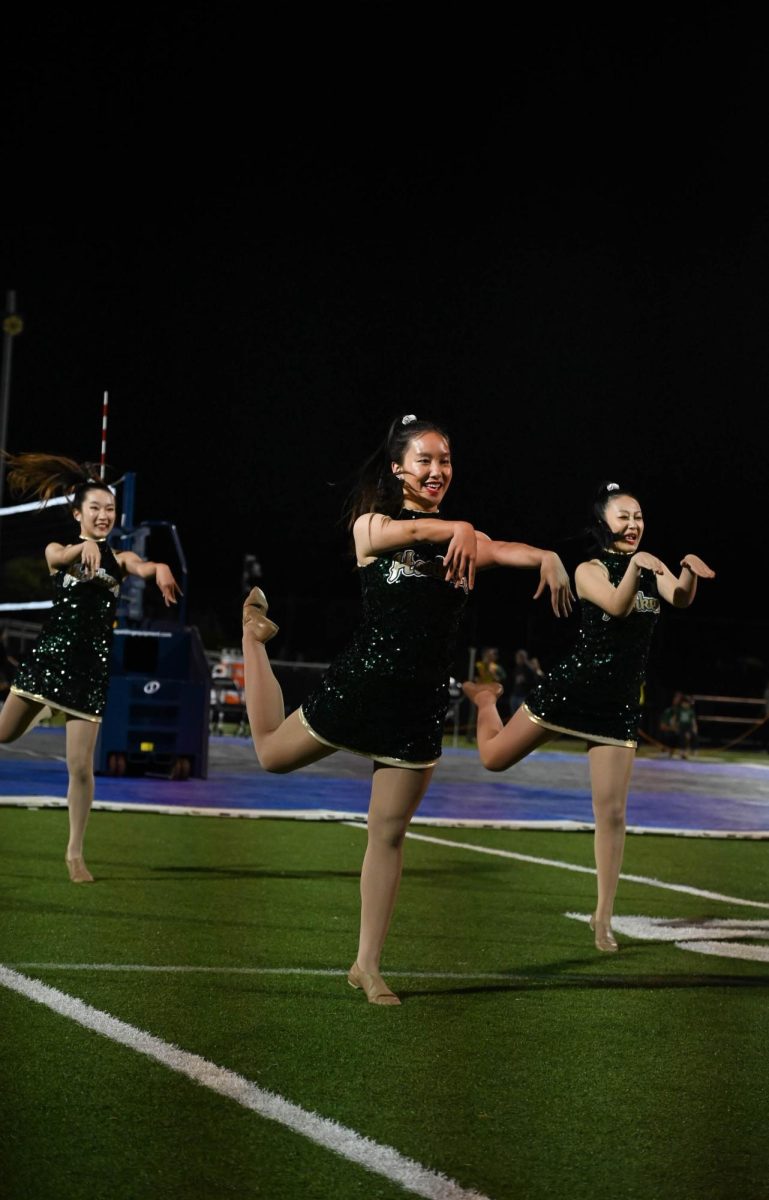 HDC dancer Hannah jiang (11) performs during halftime. Halftime performances occurred after the conclusion second set.