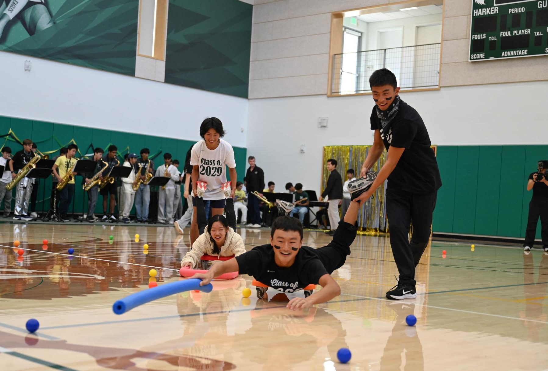 Sophomore Edmund Wang stretches to corral a ball during the Picky Picky Hippos relay game. The juniors won the event, with the sophomores coming in second place.
