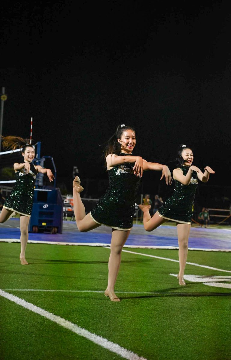 HDC dancer Hannah jiang (11) performs during halftime. Halftime performances occurred after the conclusion second set.