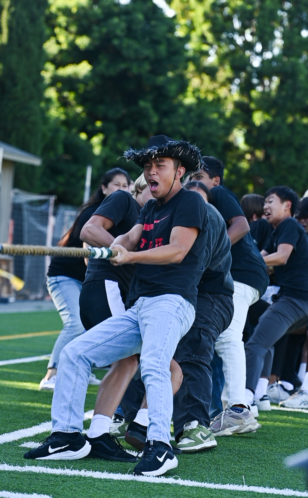Sophomore Aden Liu leads his Class in the tug-of-war match against the frosh. The Class of 2028 won third place.