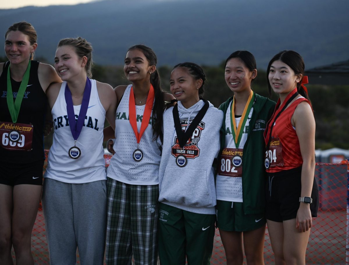 Junior Samaara Patil, junior Ava Alvarez and frosh Sophie Shen smile for a photo with their medals. They were awarded for their seventh, eighth and ninth place finishes during a ceremony after the meet. 