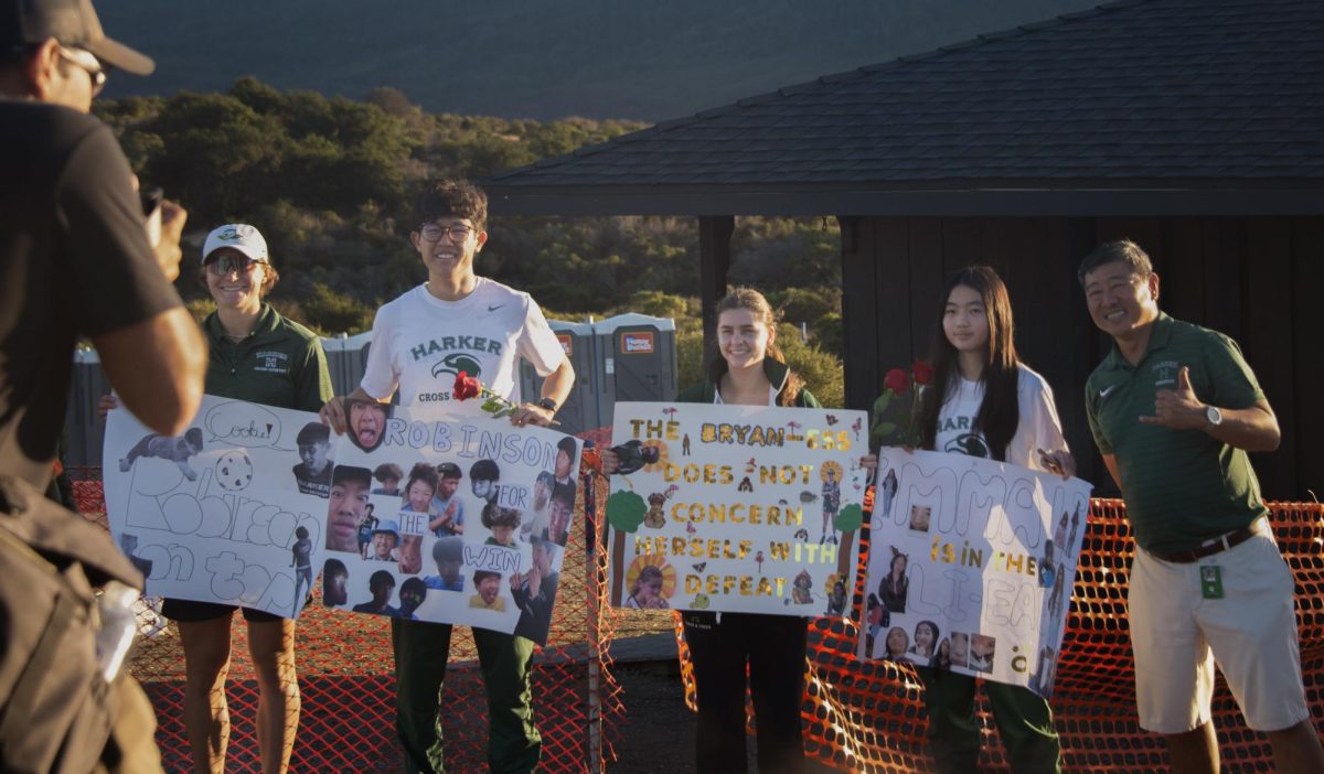 Seniors Robinson Xiang, Emily Bryan and Emma Li pose with their personalized posters and roses with coach Jorge Chen. Seniors were honored in a senior night ceremony at Crystal Springs with gifts and bouquets.