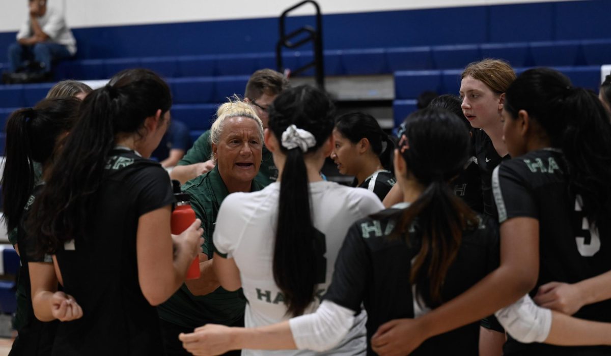 Coach Smitty gives the team a pep talk during a time out during their season opener against Branham. This win helped them move to win their CCS quarterfinals game 3-1 against Notre Dame-Belmont.
