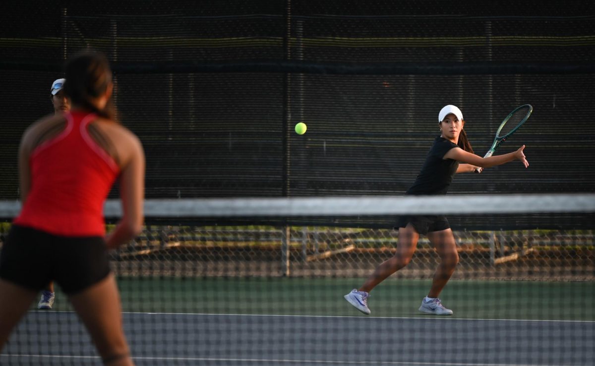 Varsity girls doubles tennis player Alyssa Lee (9) swings her racket to return a shot. She helped the team reach CCS semifinals, where they lost 2-5 to Los Altos.