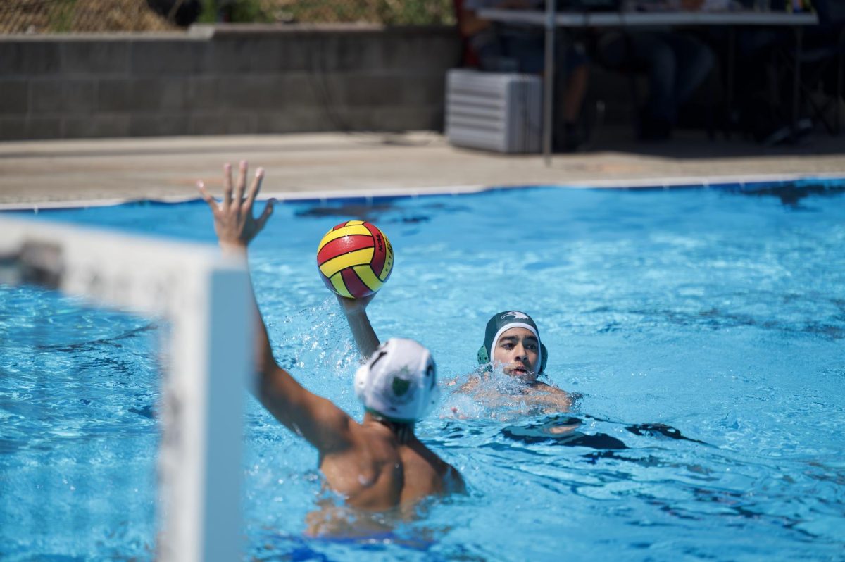 Junior varsity boys water polo field player Siddharth Hoskere (9) looks for a pass during a six-on-five possession. The jv team had an overall record of 1-15.