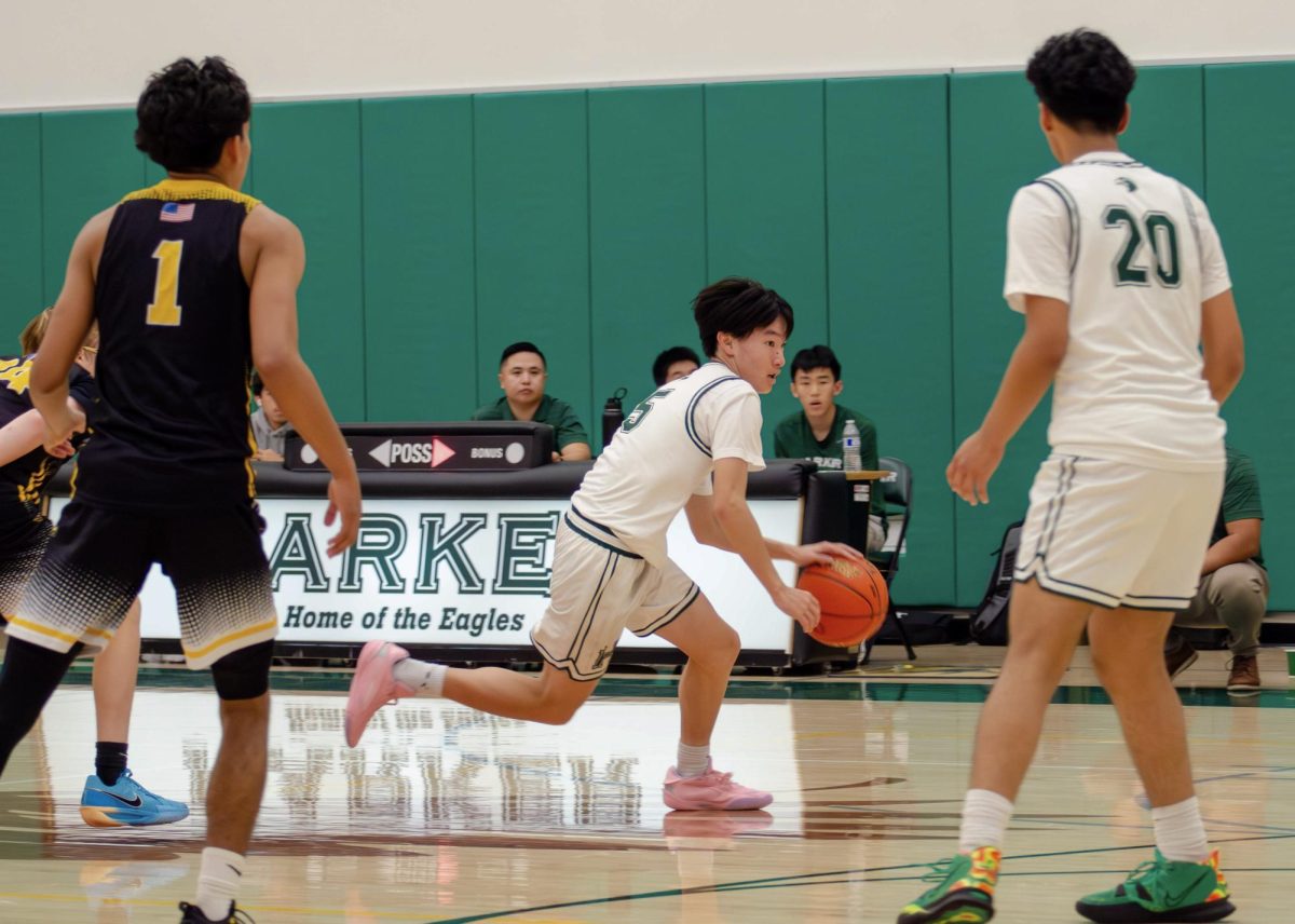 Guard Stephen Gao (9) handles the ball at the top of the key. The Harker guards facilitated a pass-heavy half court offense.