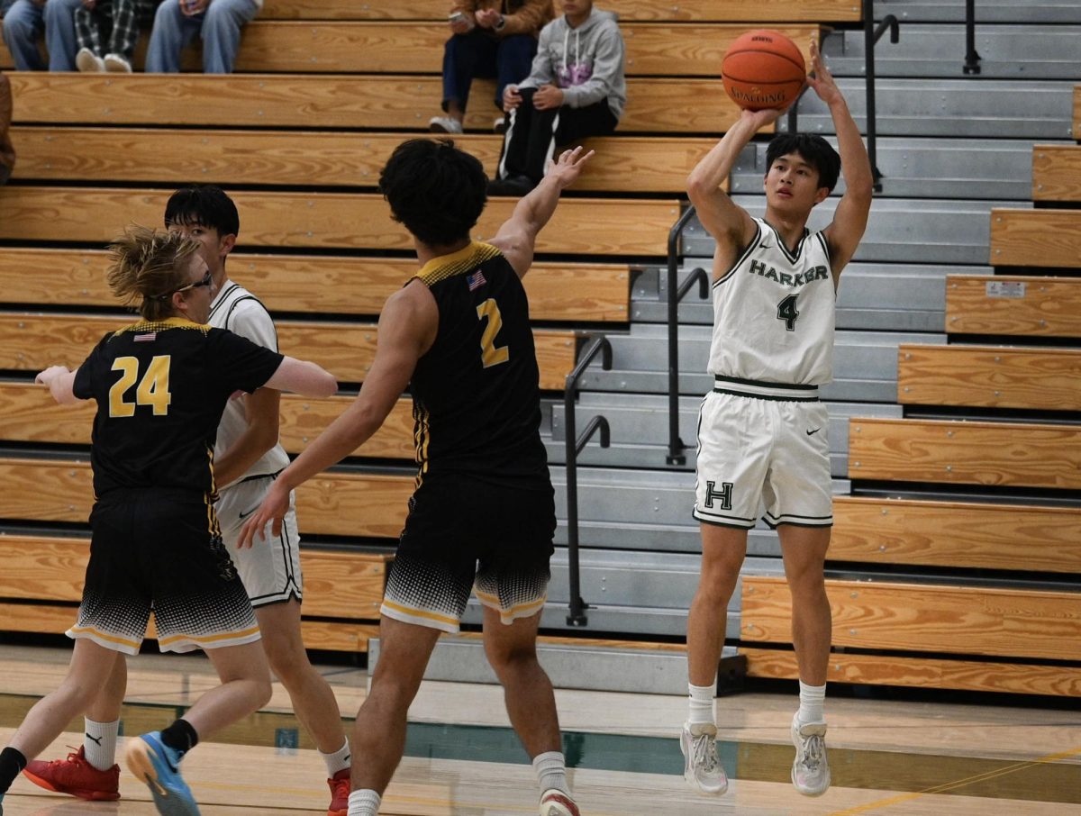 Guard Lucas Huang (10) shoots a corner three pointer. Lucas helped the Eagles gain an early lead by hitting his first three attempts from beyond the arc.