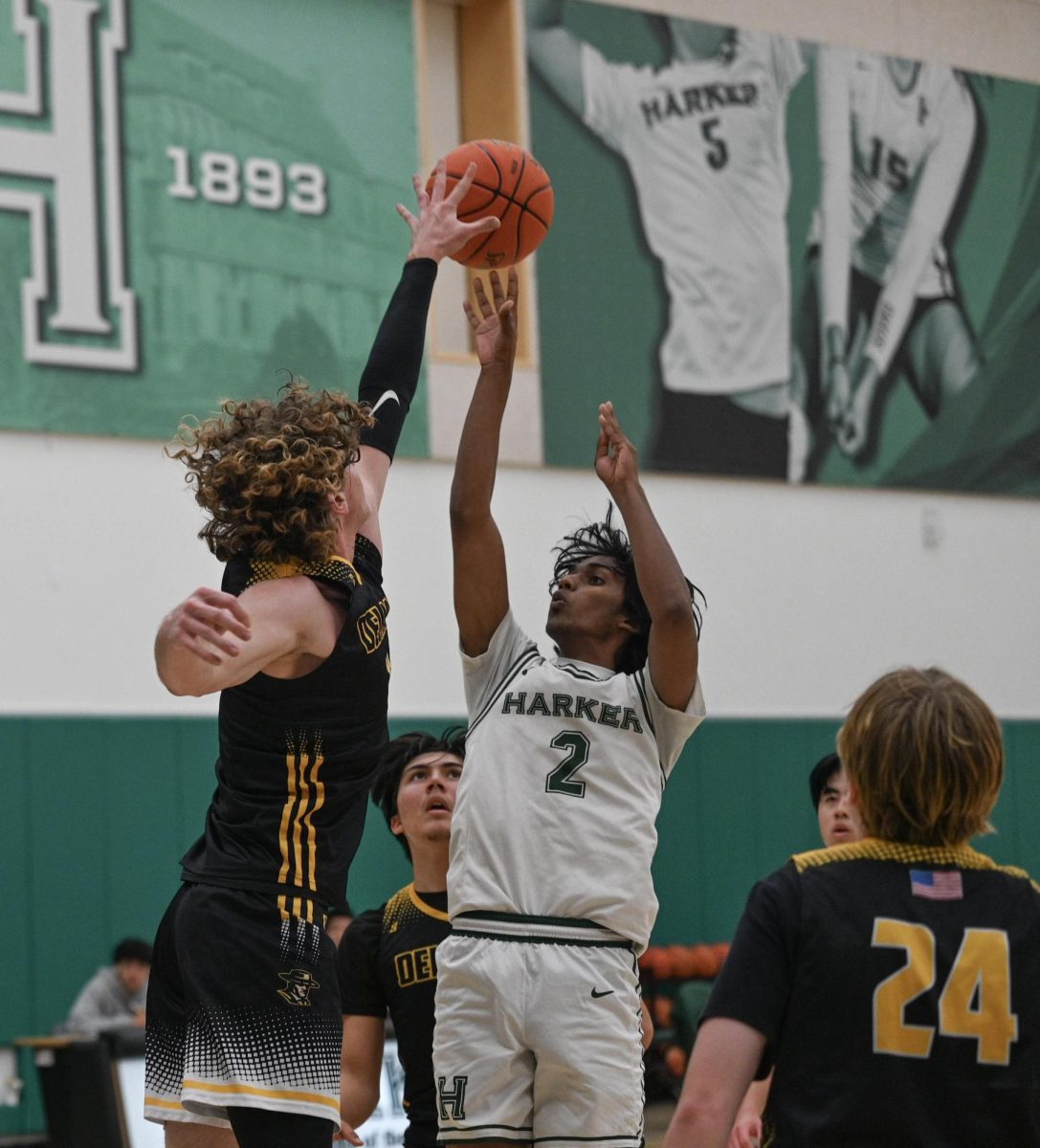 Guard Rishaan Thoppay (12) attempts a fadeaway in the paint. By rapidly passing around the perimeter, the Eagles found open lanes to attack the paint.
