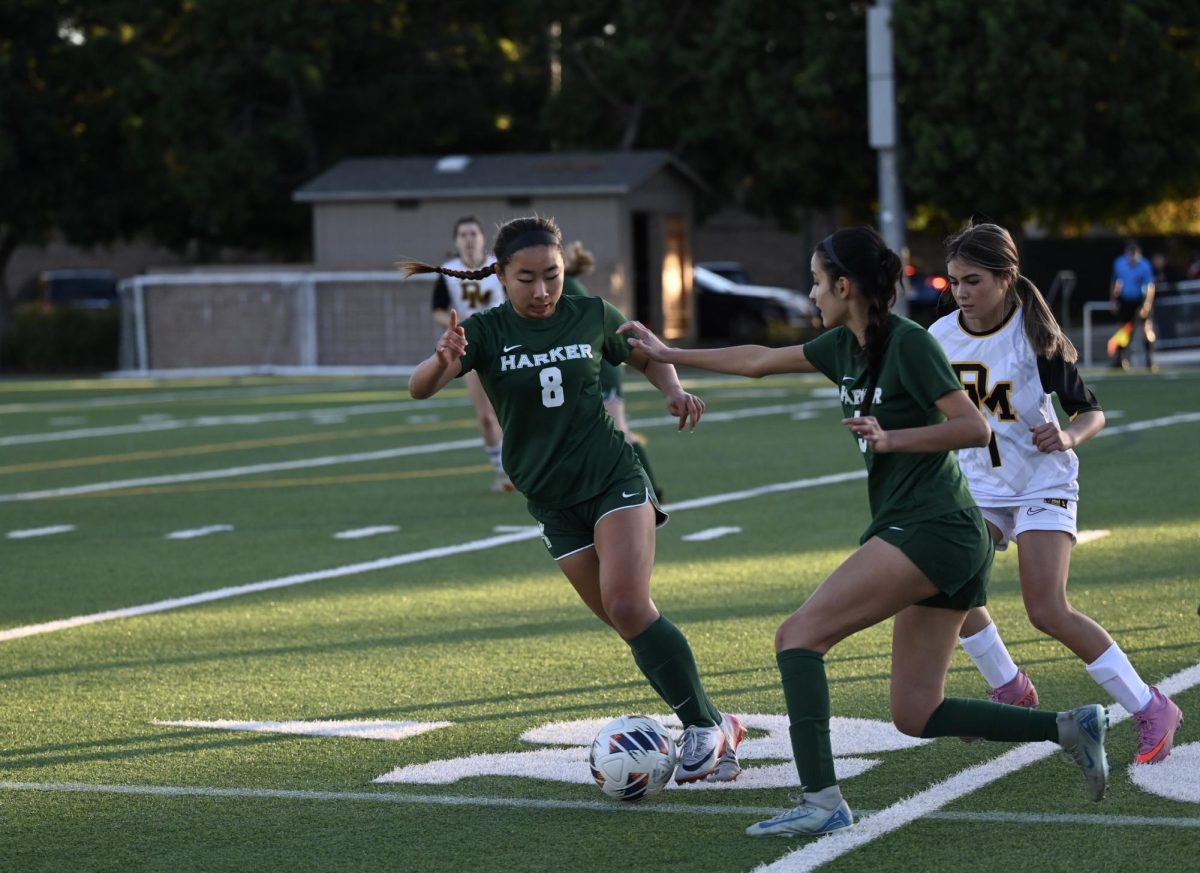 Attacking midfielder Eva Cheng (12) points ahead for winger Aanya Sharma (11). Eva contributed multiple assists throughout the game, making leading passes for her teammates to score.