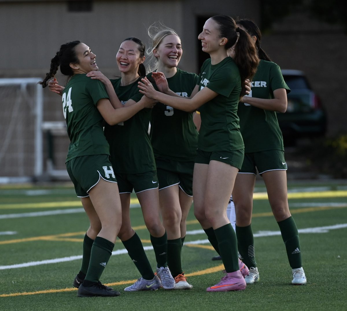 Varsity girls soccer team celebrates after the first goal by attacking midfielder MacEnzie Blue (12). MacEnzie showed leadership and guidance, allowing her to step into the position of co-captain at the end of the game.