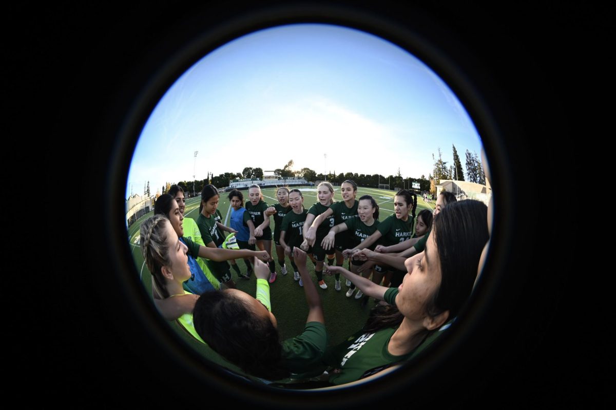 Varsity girls soccer team cheer before the game. Each of the captains encouraged the team to fight hard for this game.