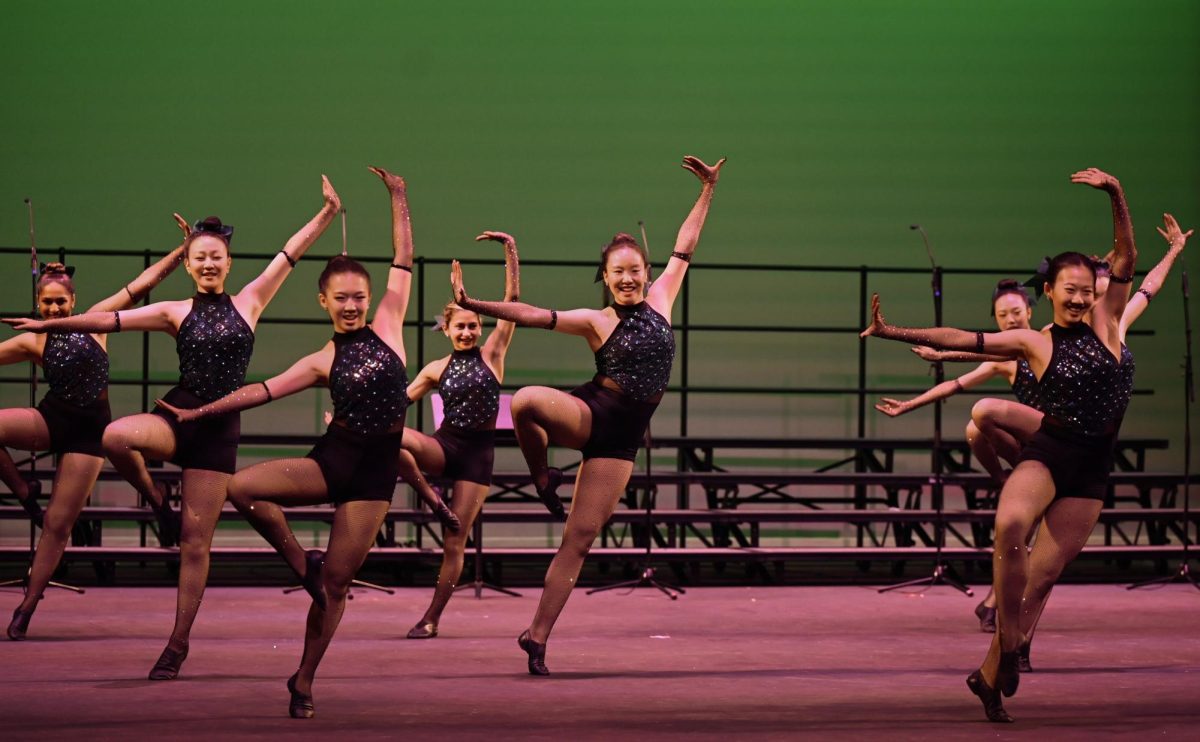 Junior Hannah Jiang executes a passe during Harker Dance Company's jazz routine. "This was all of our first time choreographing a routine for the team," junior team member Isabelle Niu said.