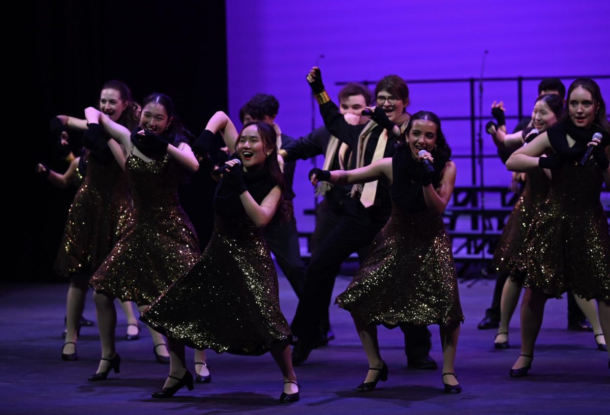 Downbeat members Jessica Skylar Chen (11) and Megha Unny (11) groove while performing “Don’t You Worry About A Thing.” Downbeat performed twice in the Big Assembly Day show.