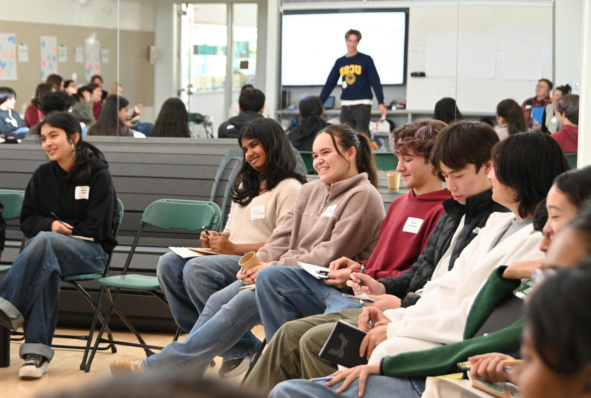 Junior Dhanya Ramanan and senior Sofia Vasquez-Perez smile while listening to another student share their thoughts about the event. Attendees had the opportunity to engage in several activities that focused on intention and perspective.