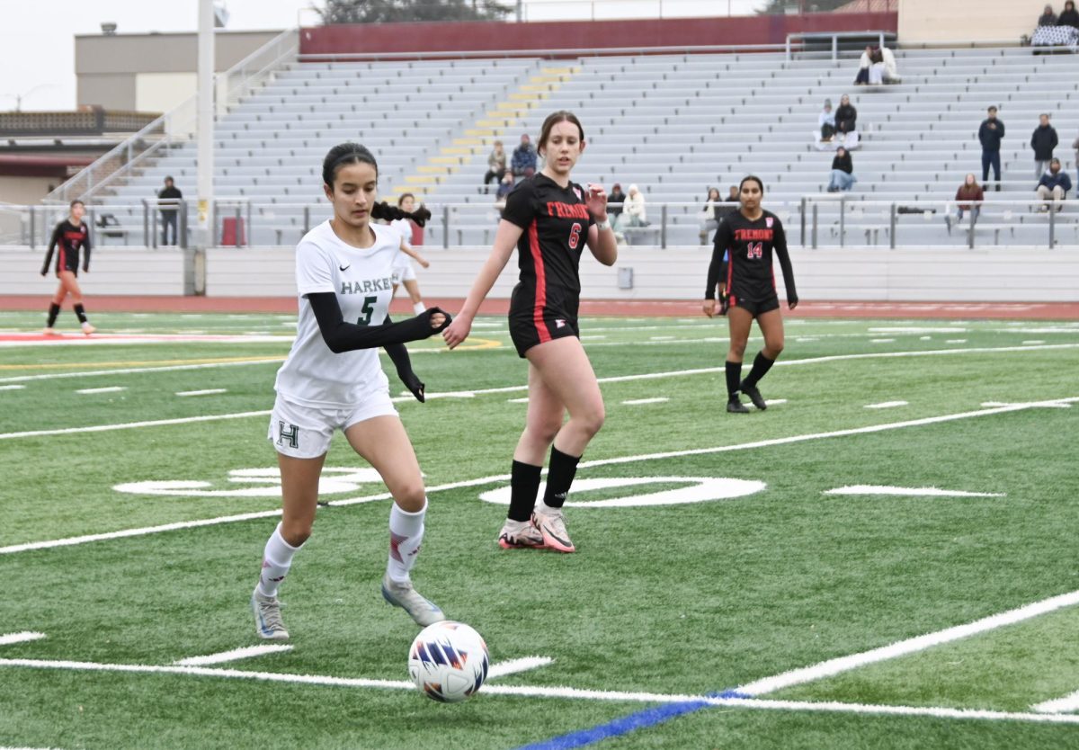 Forward Aanya Sharma (11) dribbles the ball to the Firebirds' goal and prepares to shoot. Down one point, the Eagles had less than twenty minutes to tie the game.