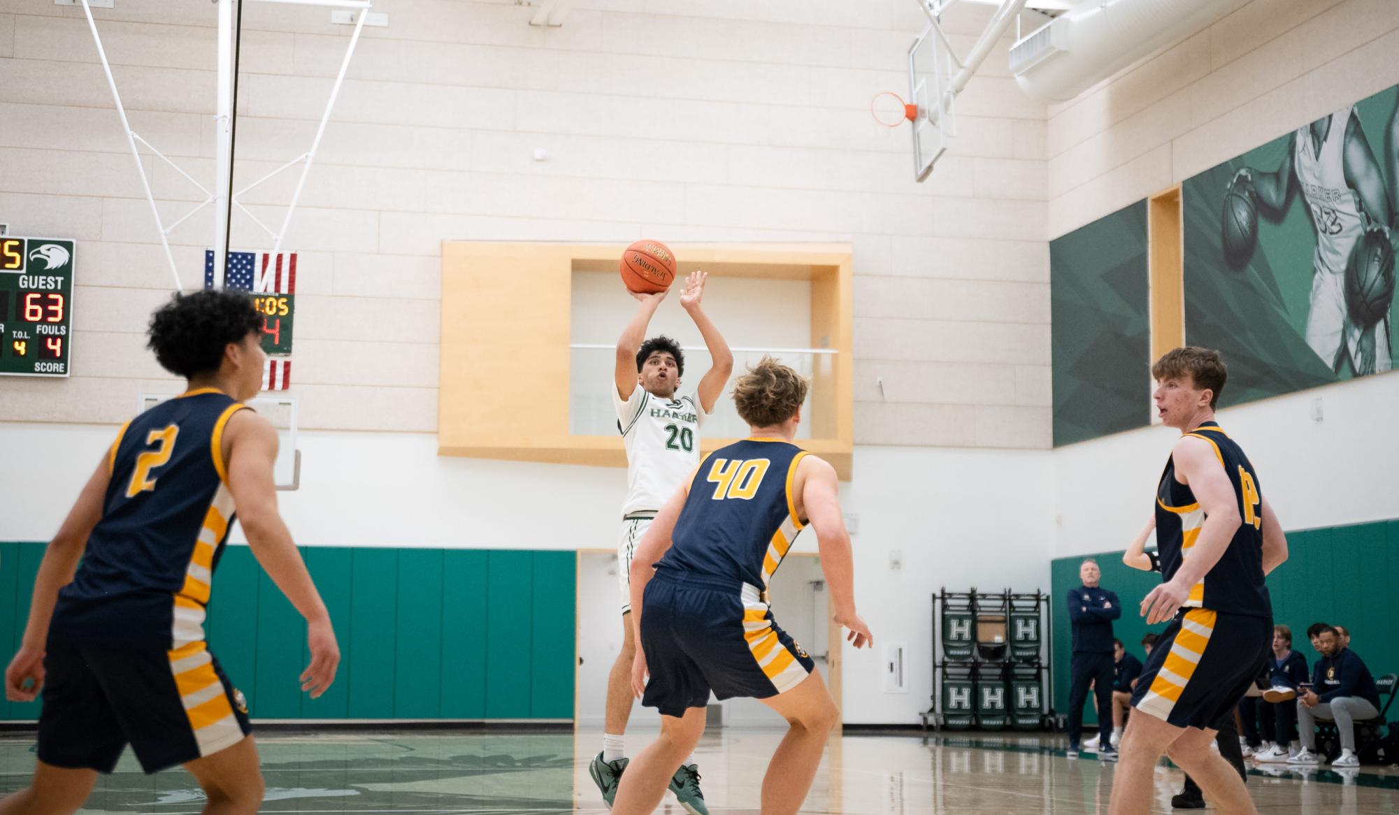 Forward Prithvi Pandey (9) pulls up for a three-pointer from the top of the key. Prithvi scored a team second-high eight points for the Eagles and shot 40% from distance.