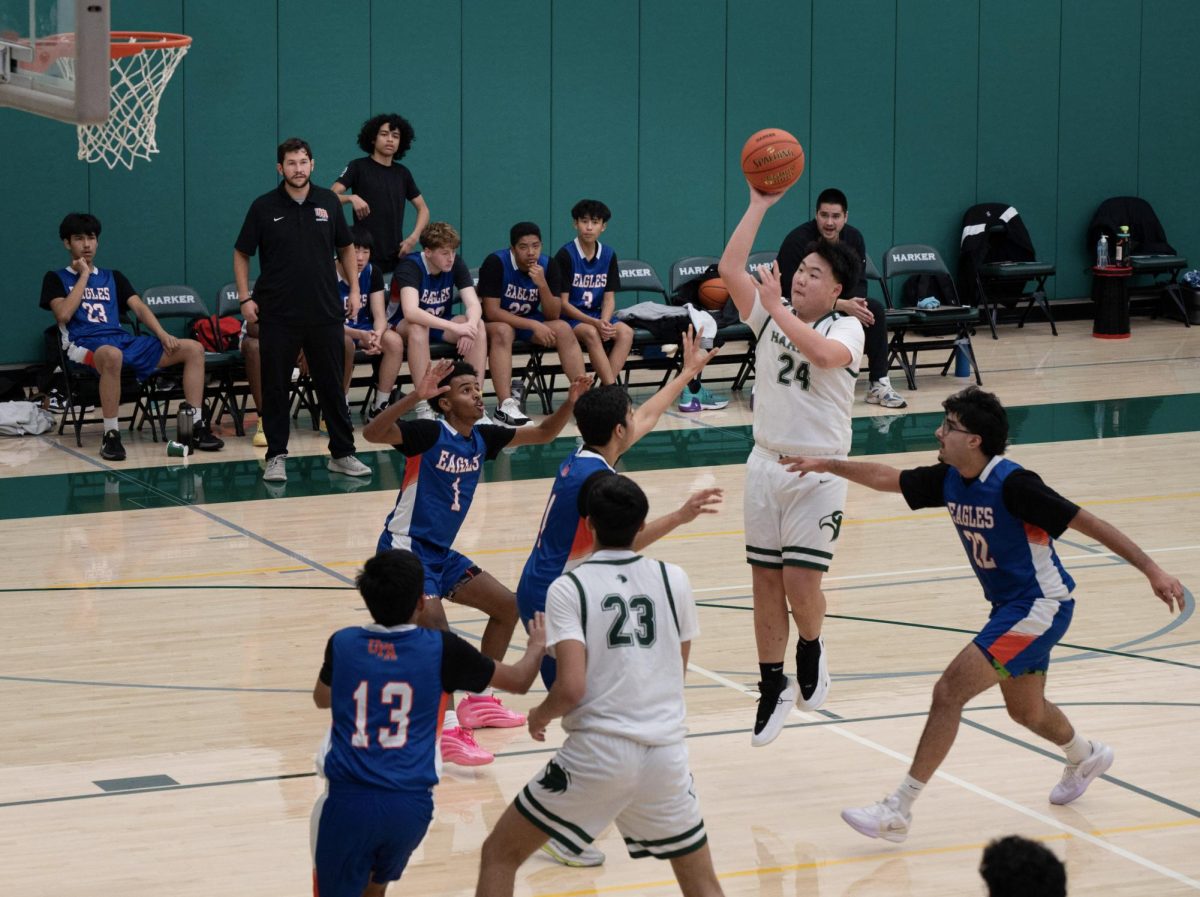 Guard Eric Zhang (9) launches a three-point attempt. The Eagles sank four straight three-pointers in the third quarter.
