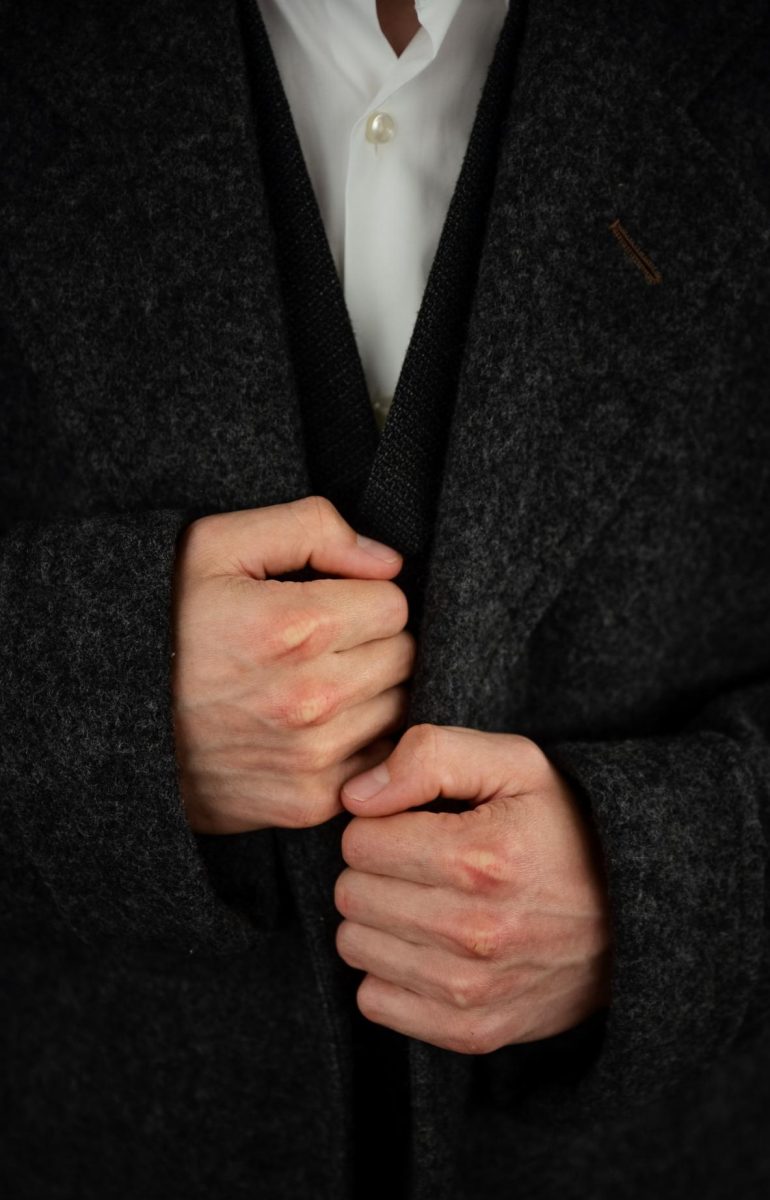 Michael Petrov (11), playing Vlad from "Anastasia," dons his coat in the dressing room before the show. Along with his friend Dmitry, Vlad devises a scheme to extort the Dowager Empress with a fake Anastasia, only to find that his candidate is the princess herself.